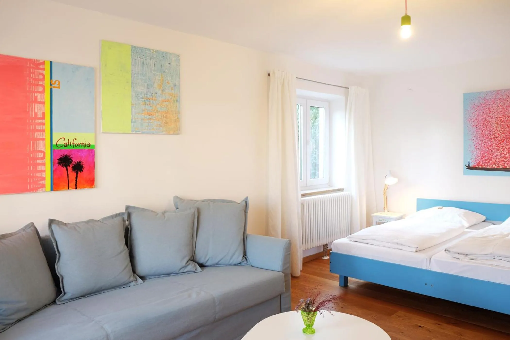 Living room, Bed in Hotel Maurerhansl