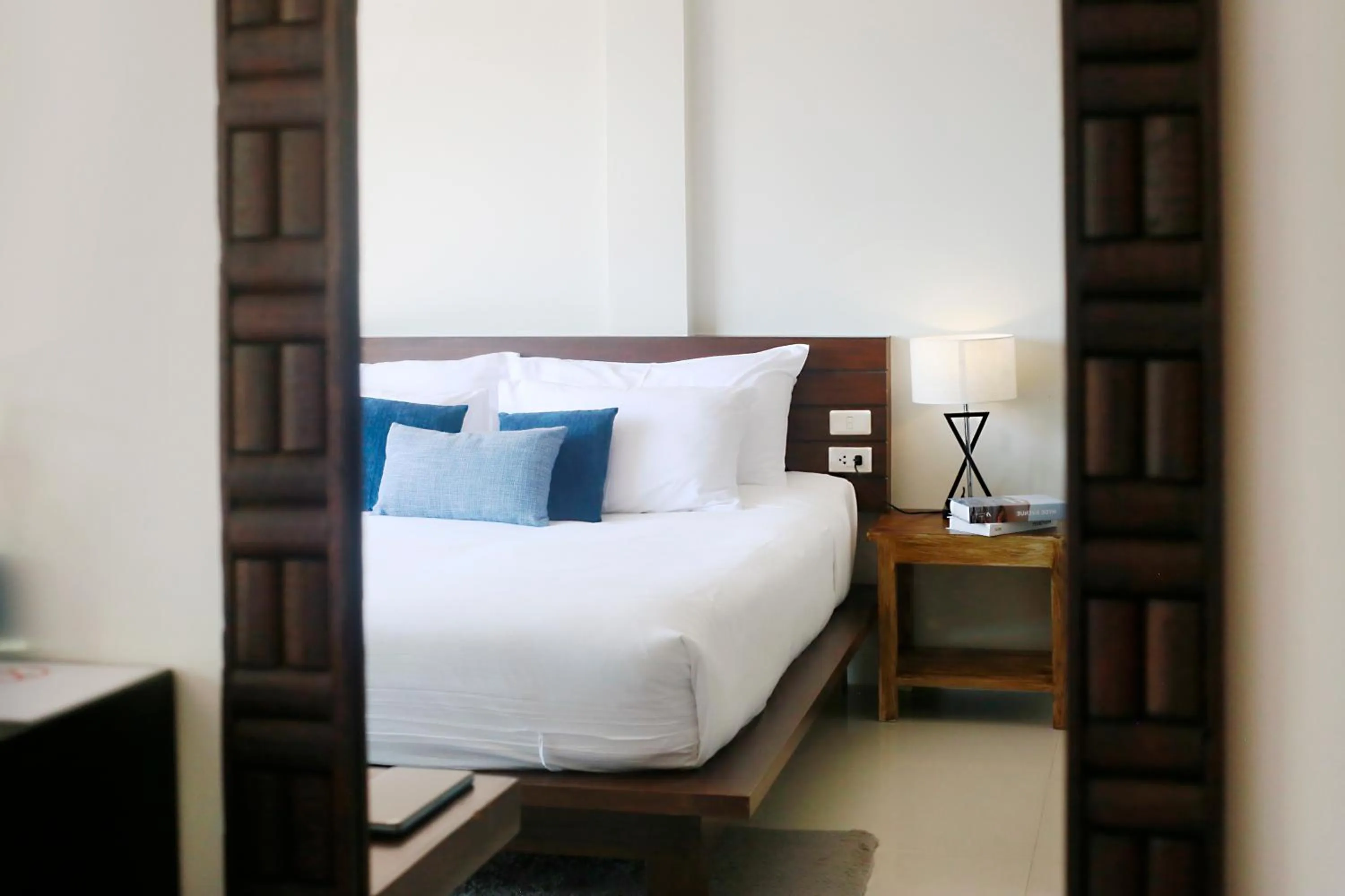 Bed in The Langstan Suites