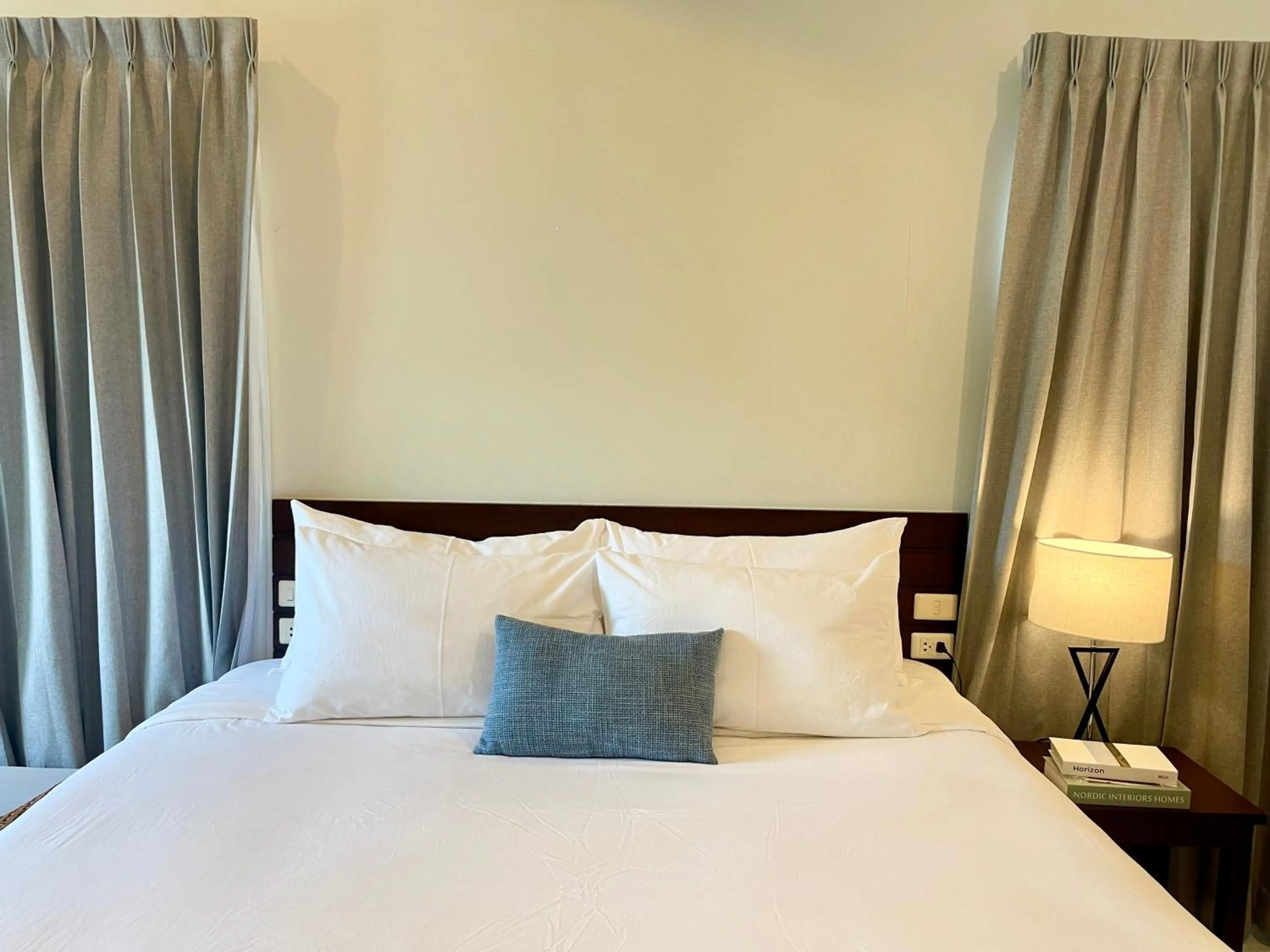 Bed in The Langstan Suites