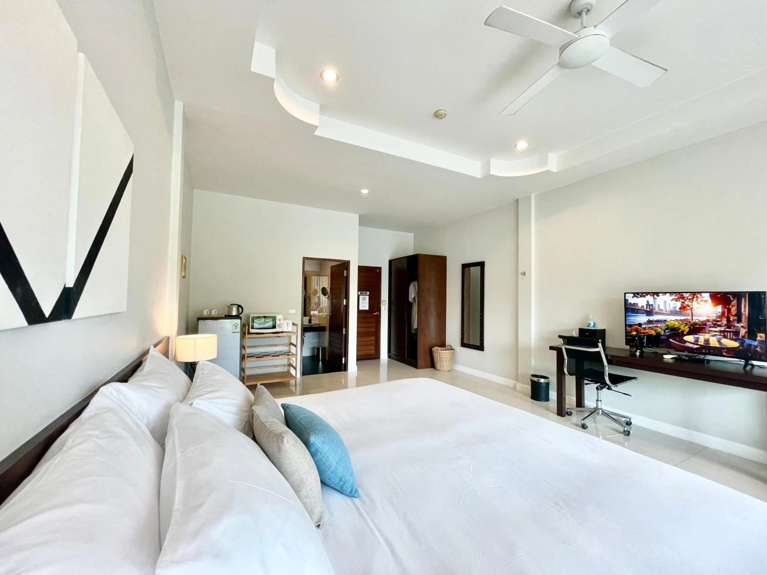 Bed in The Langstan Suites