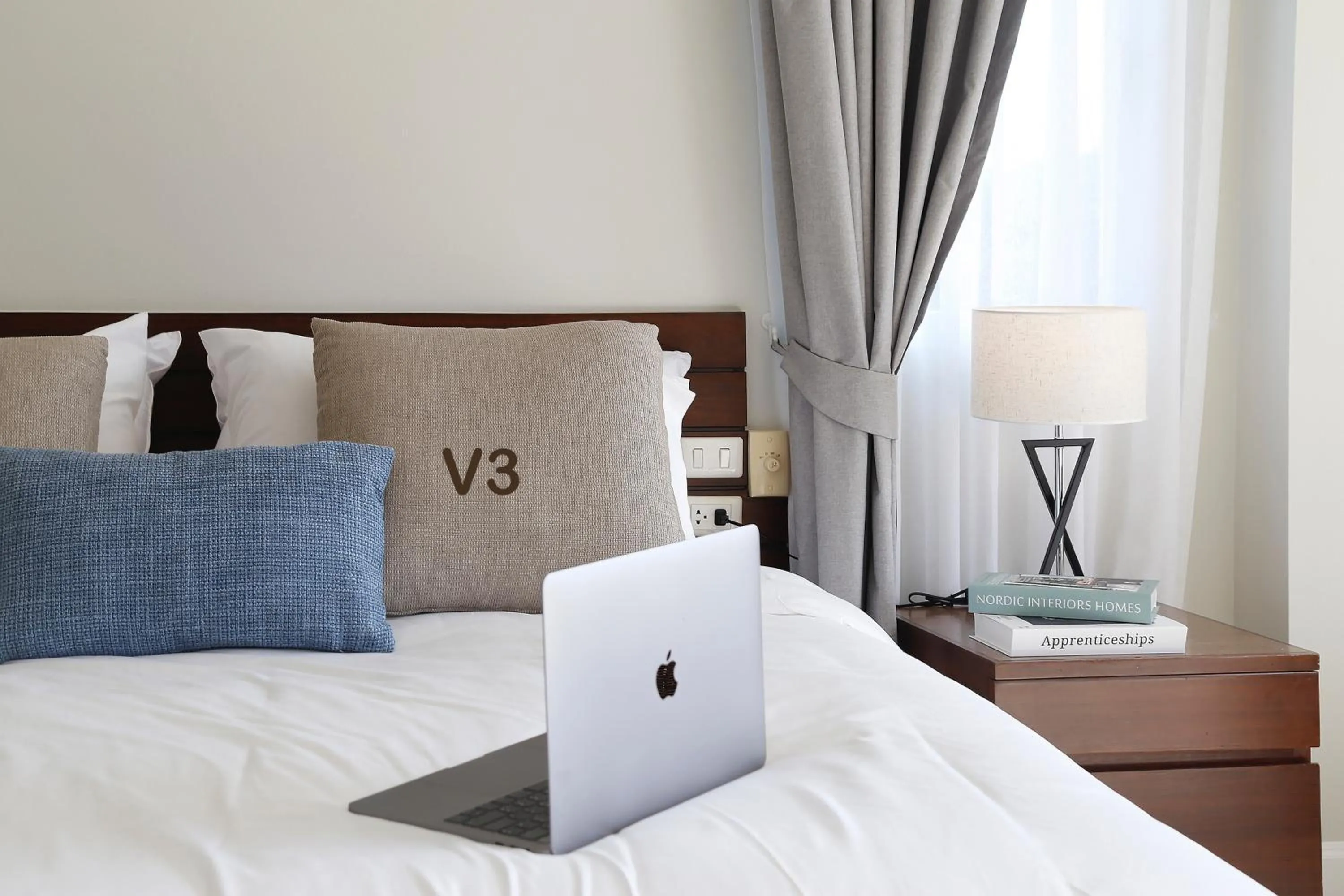 Bed in The Langstan Suites