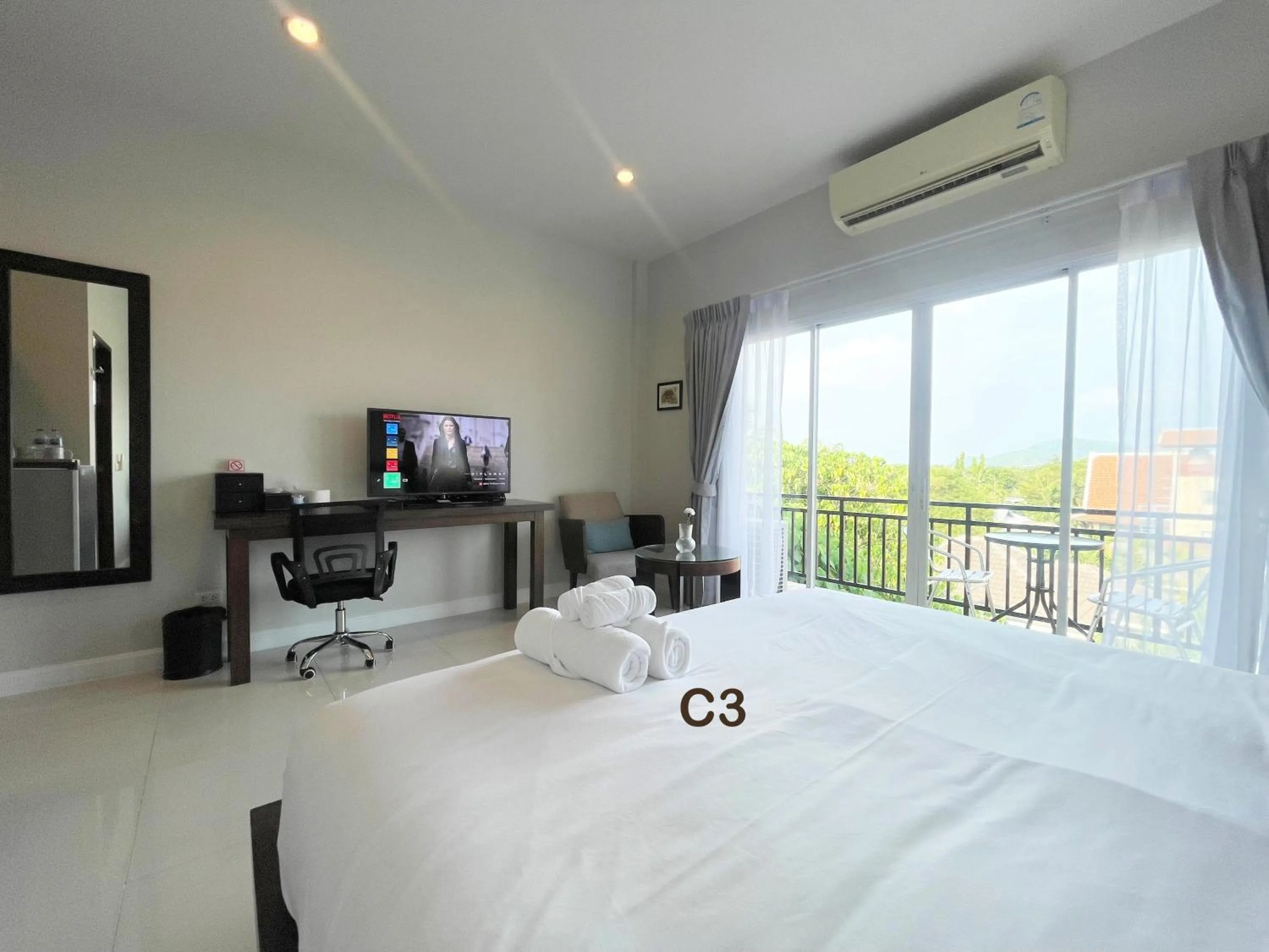 Bed in The Langstan Suites