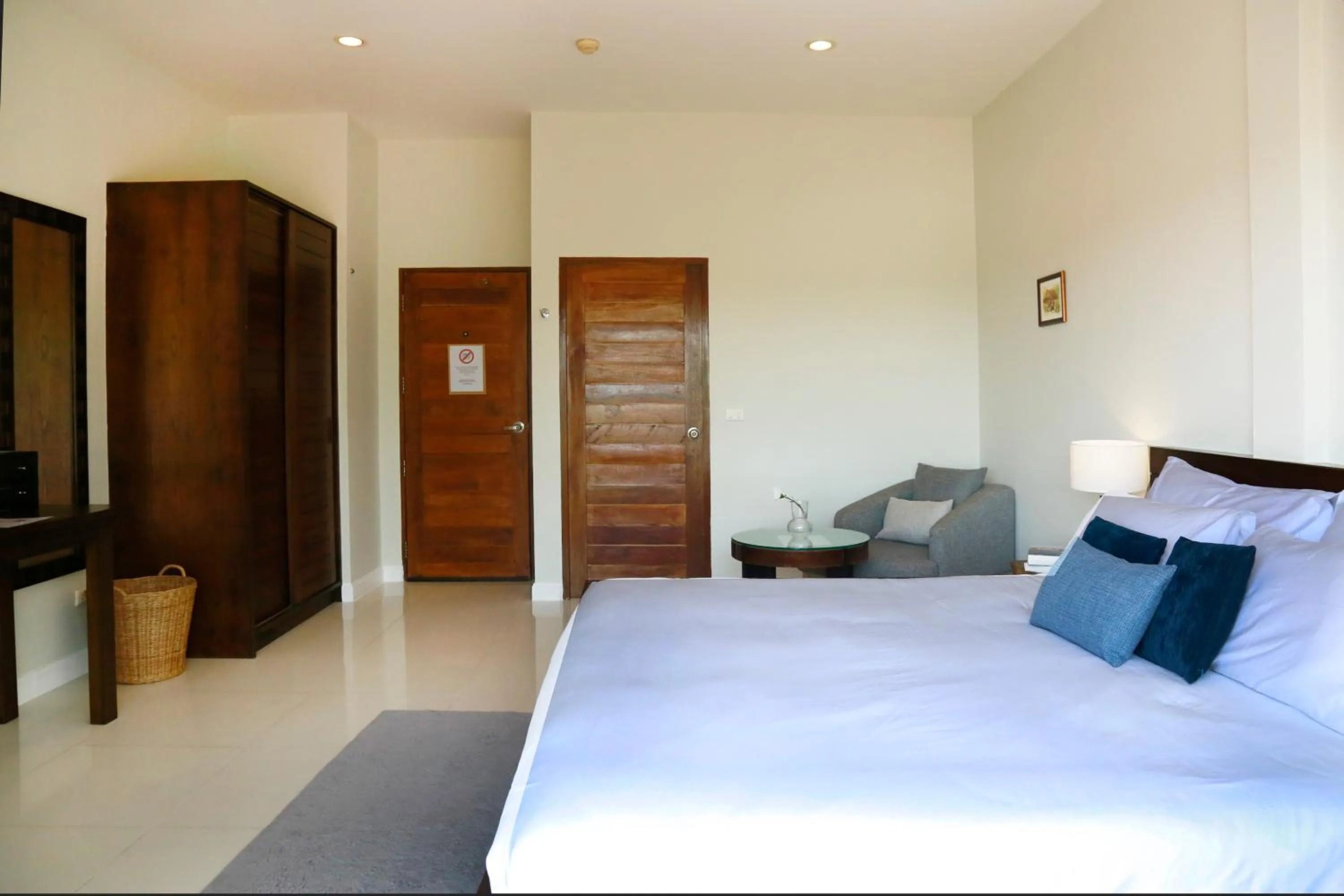 Bed in The Langstan Suites