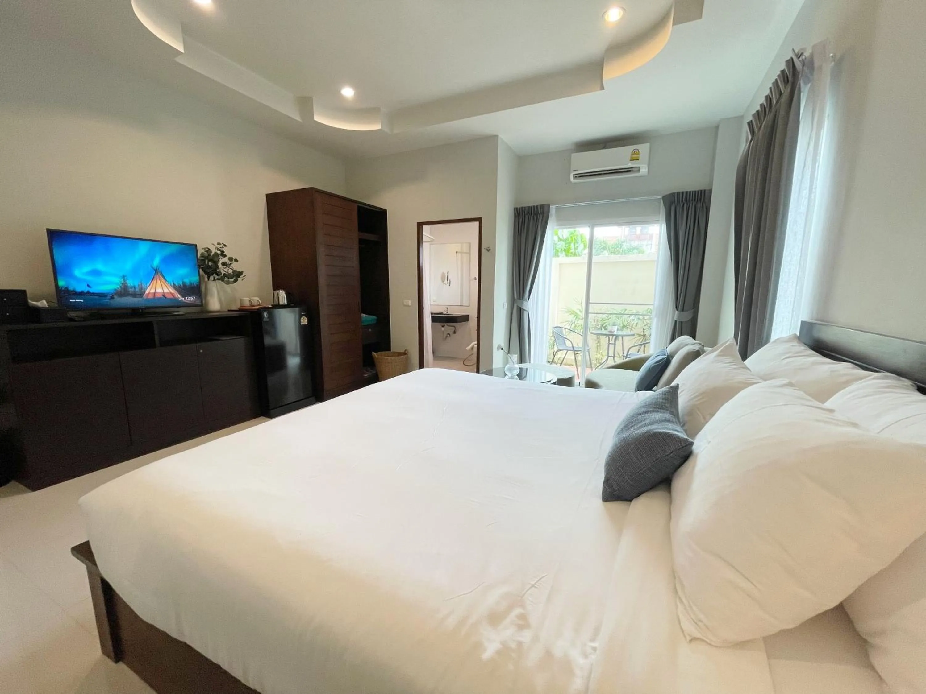 Bed in The Langstan Suites