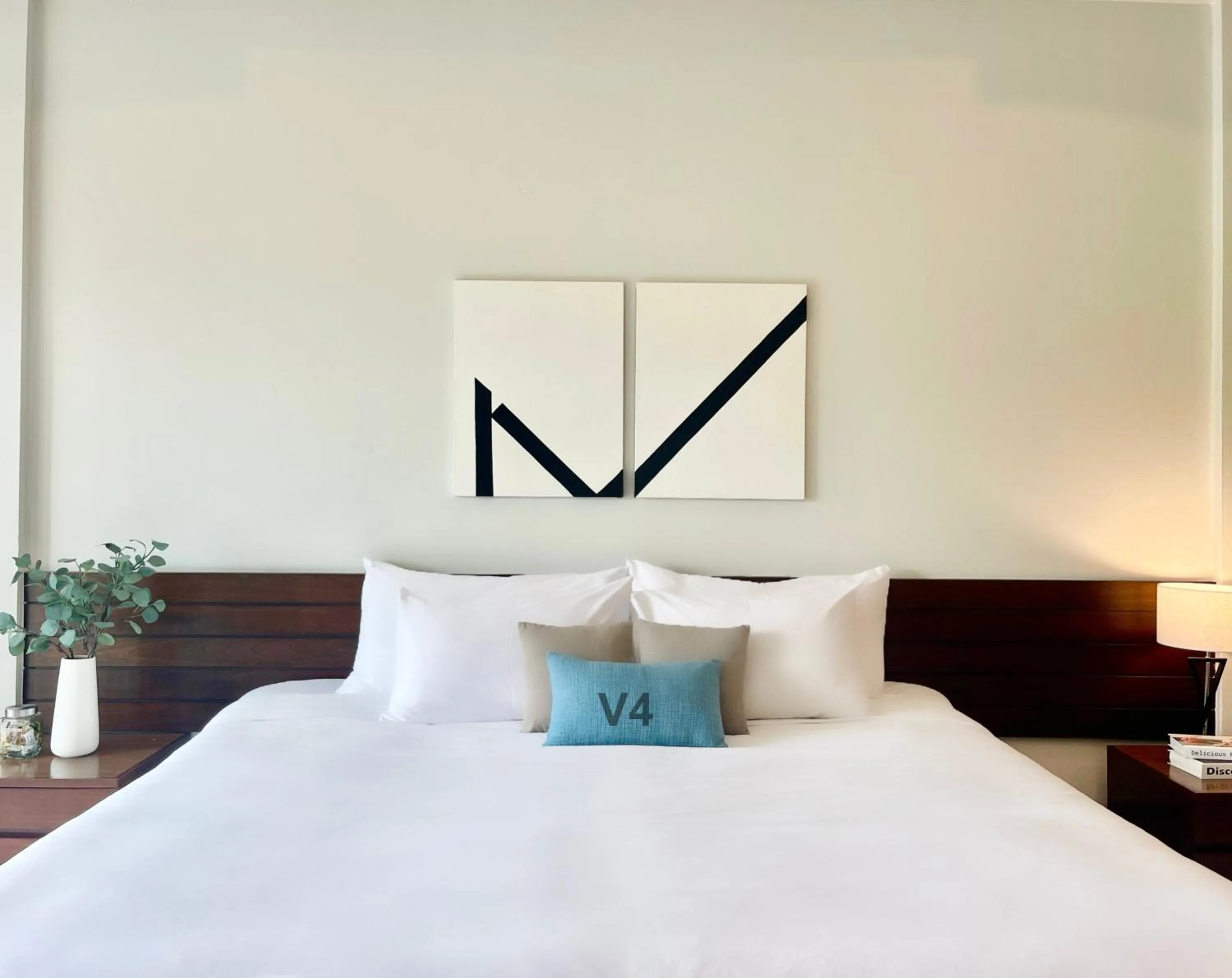 Bed in The Langstan Suites