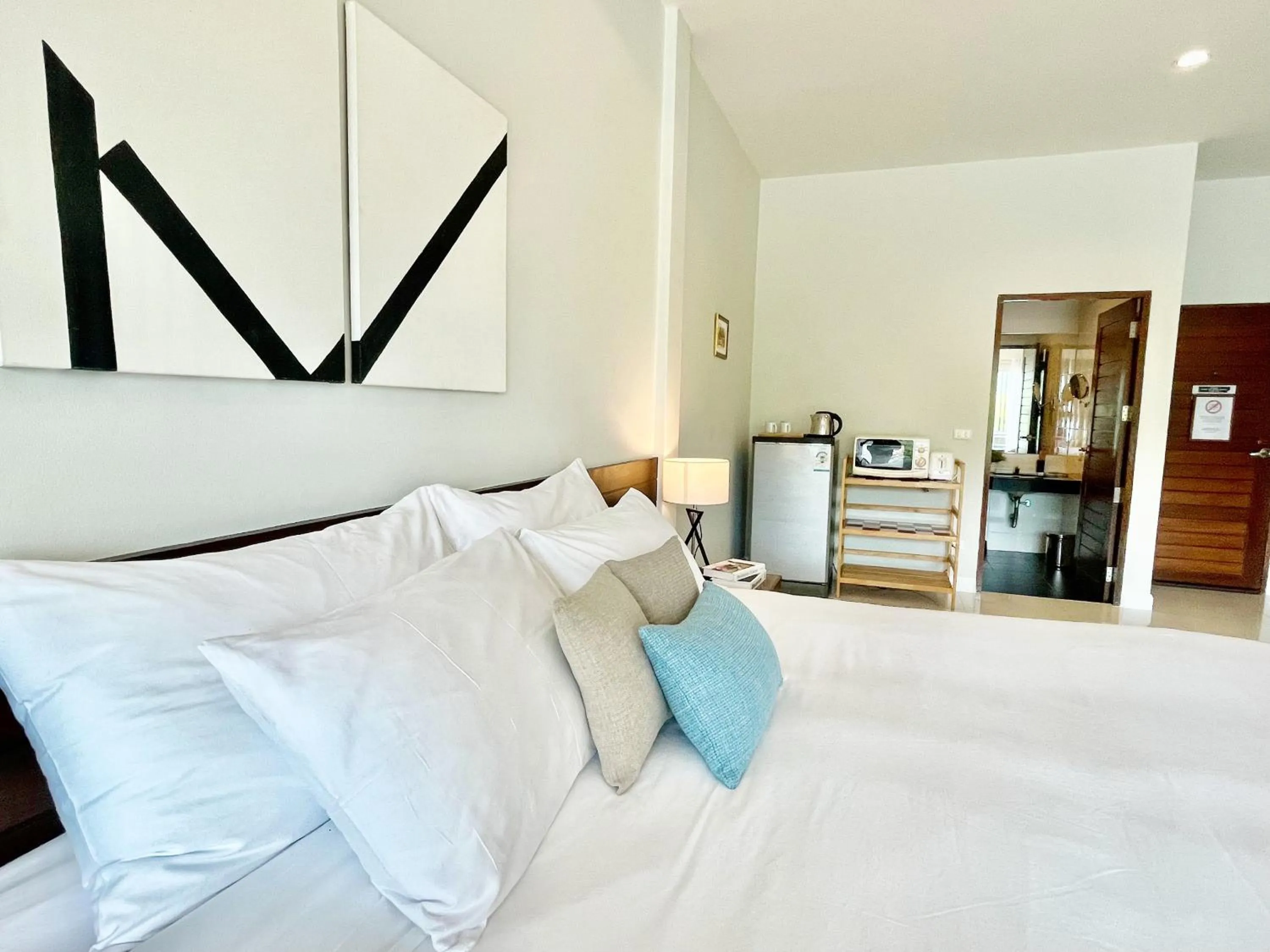 Bed in The Langstan Suites