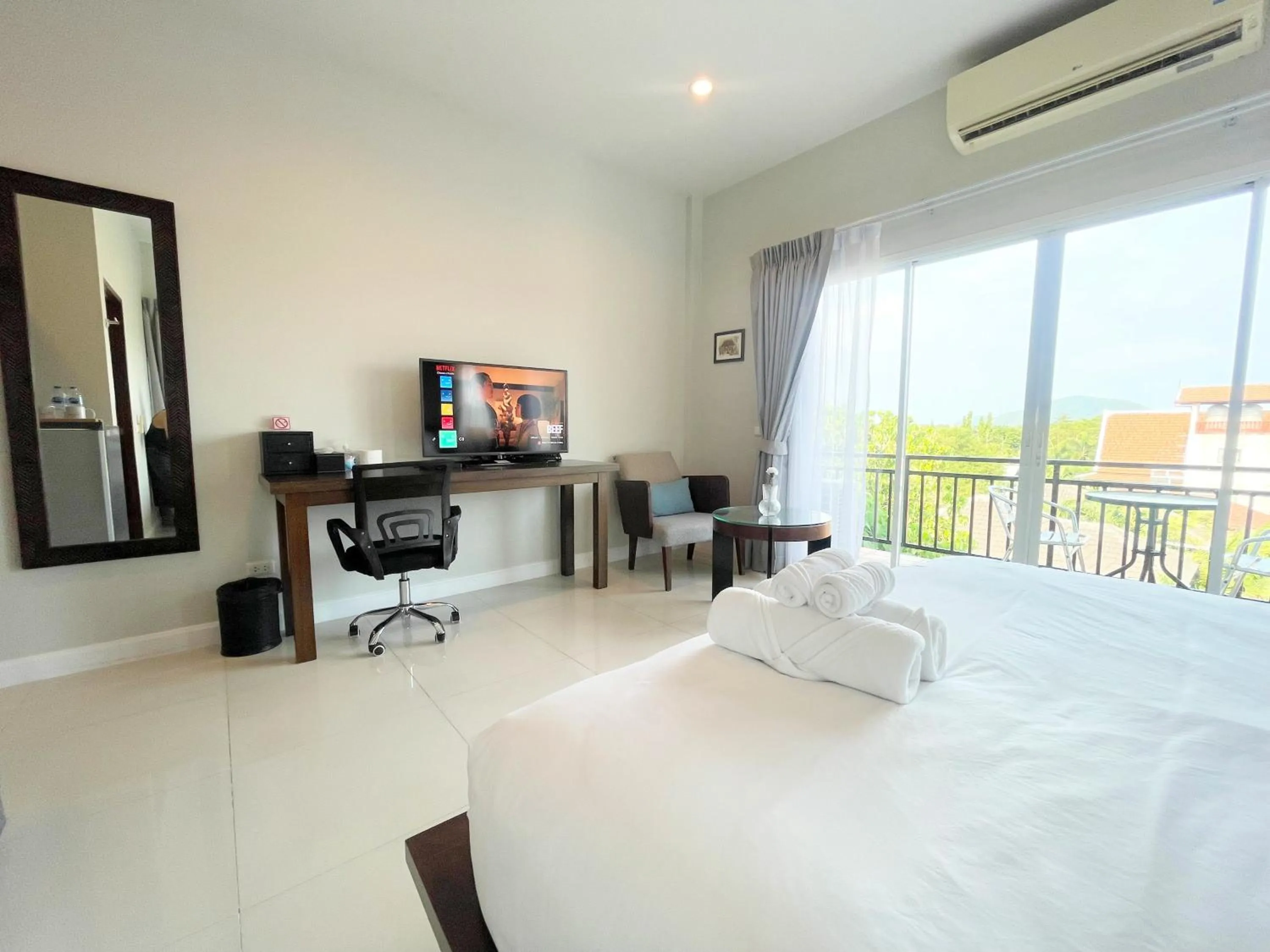 Bed in The Langstan Suites