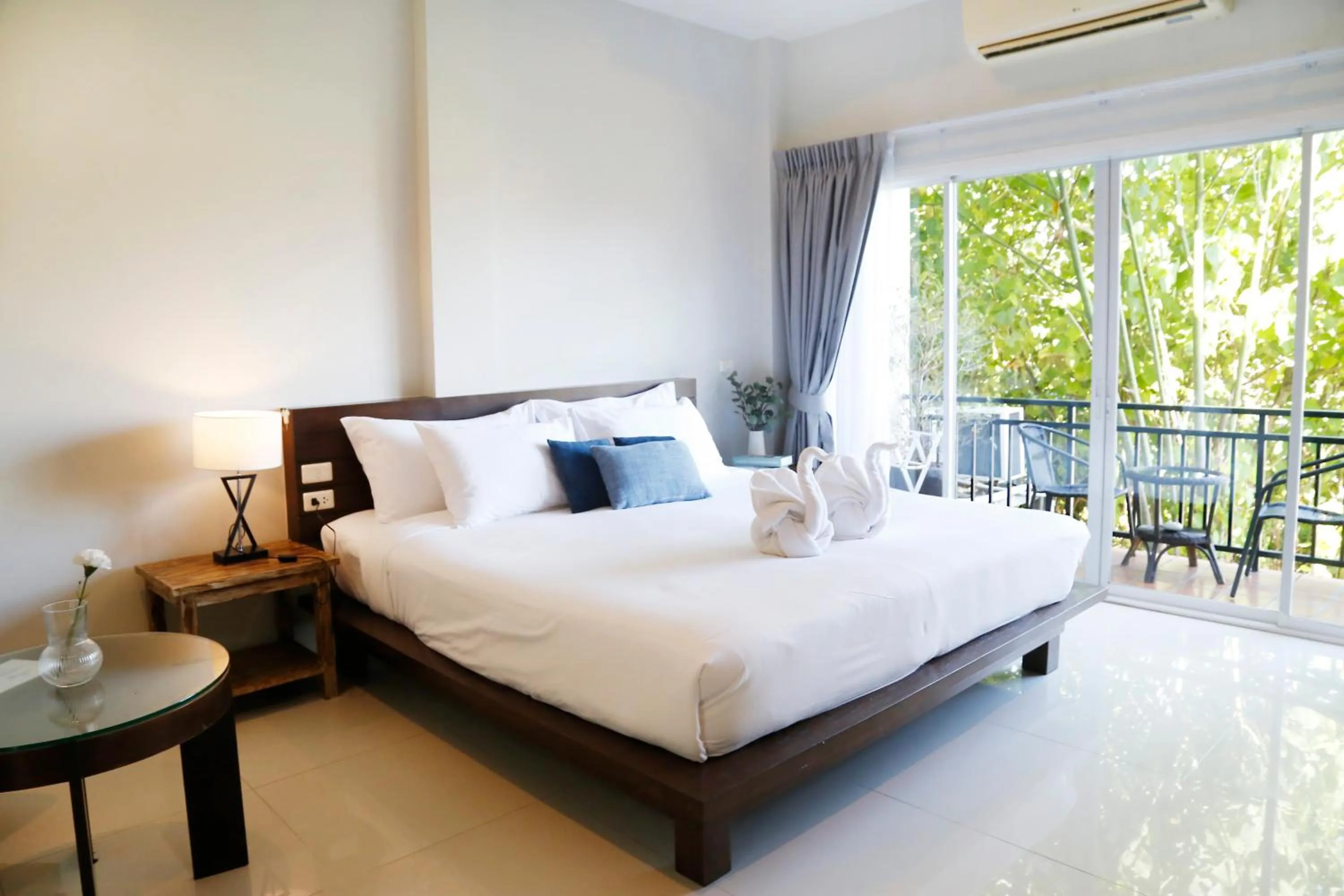 Bed in The Langstan Suites