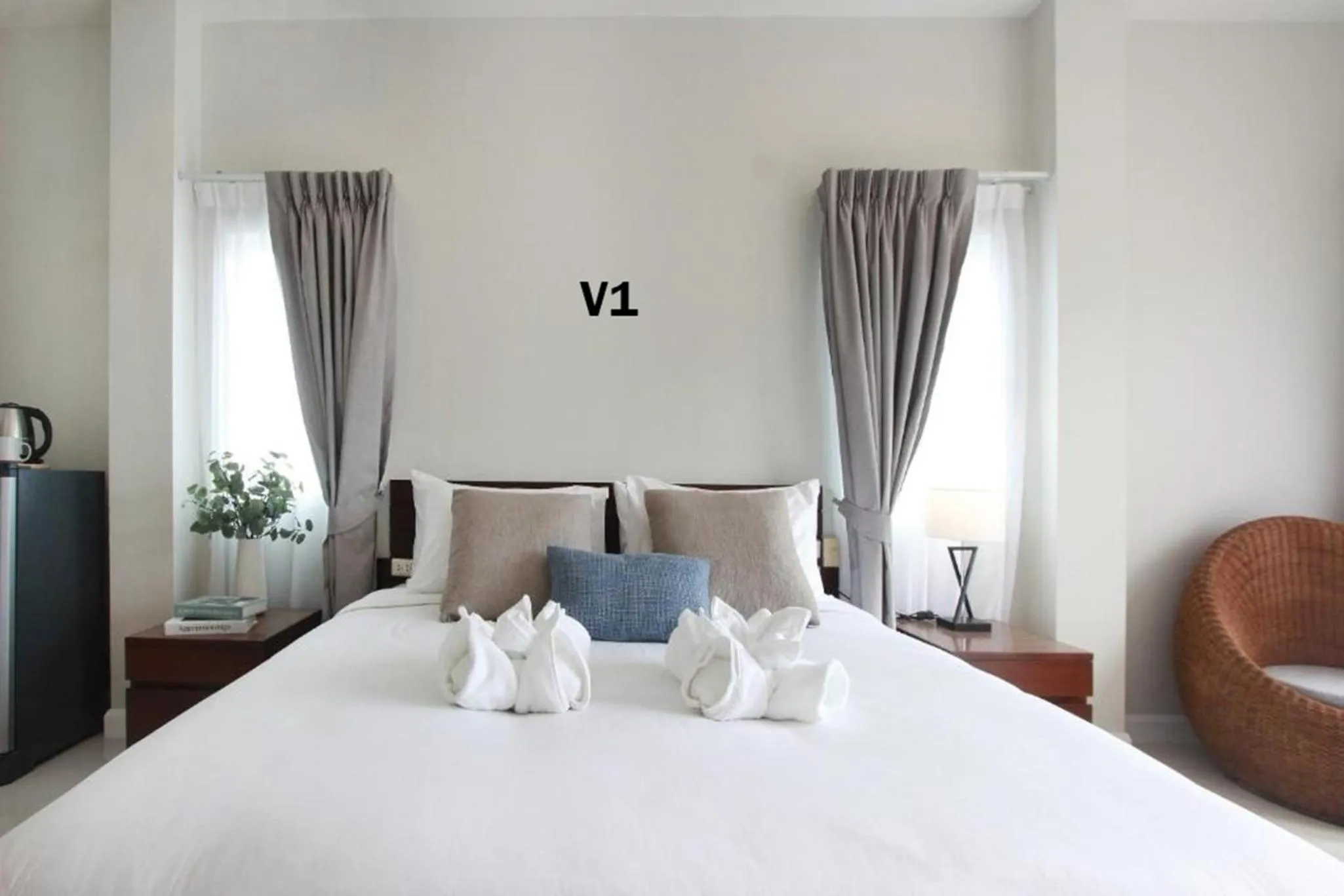 Bed in The Langstan Suites