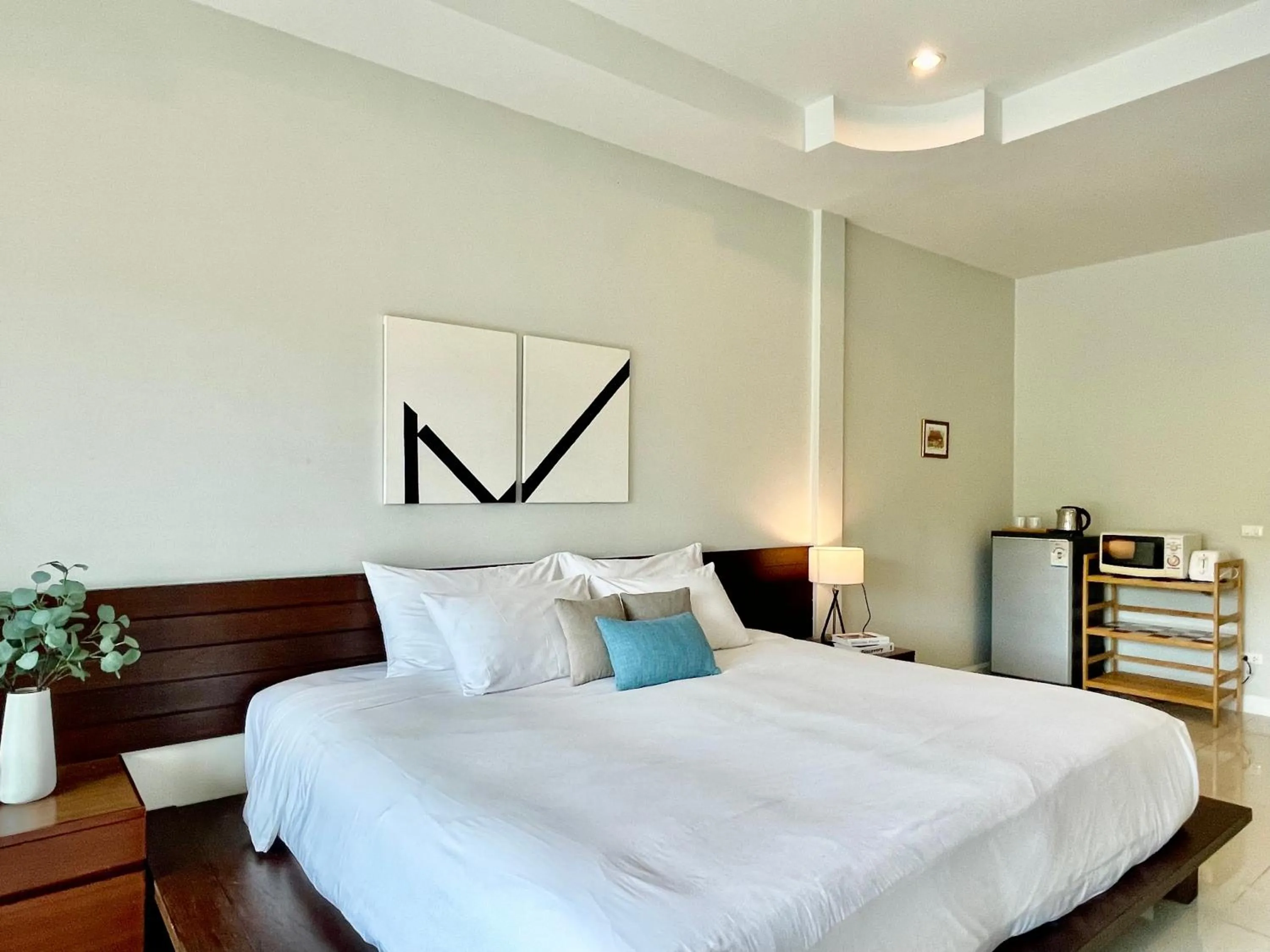 Bed in The Langstan Suites