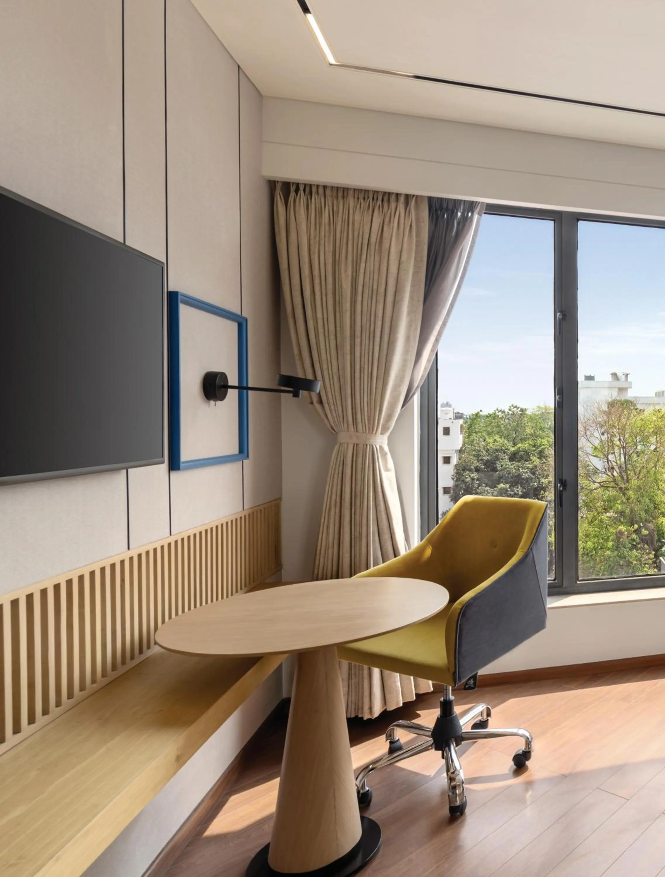 TV and multimedia in Ramada Encore by Wyndham Siliguri Sevoke Road