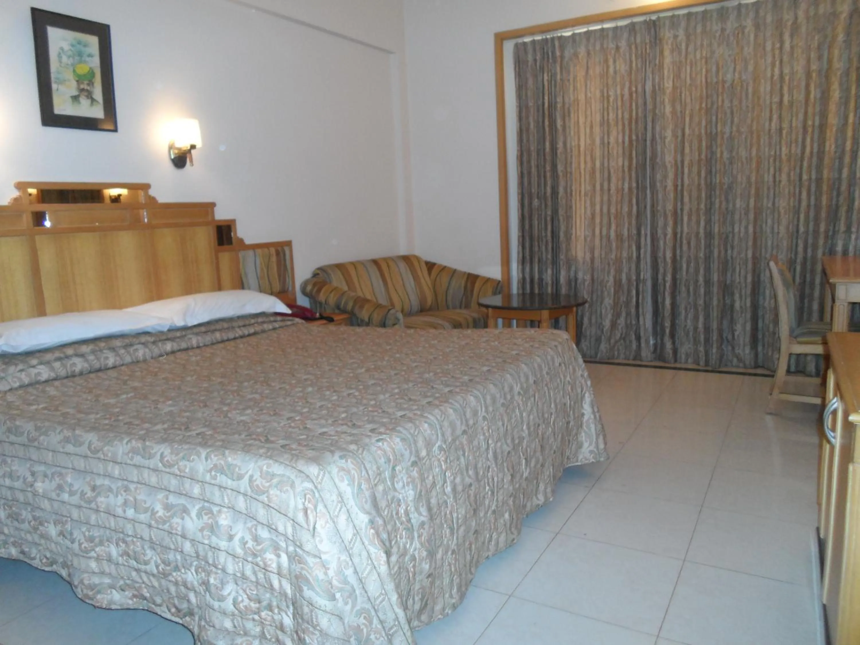 Bed in Hotel Kalyan Residency