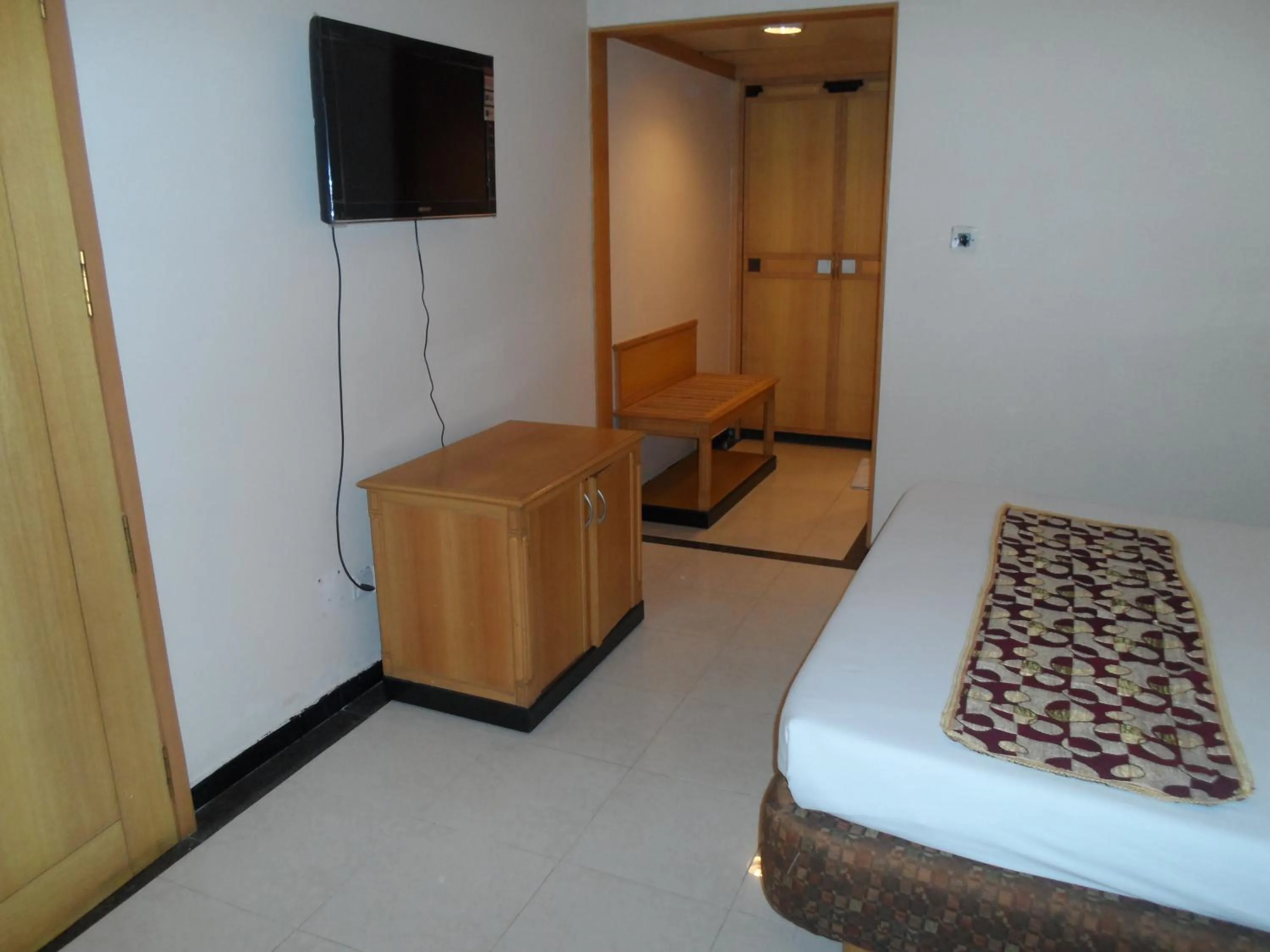 Bed in Hotel Kalyan Residency