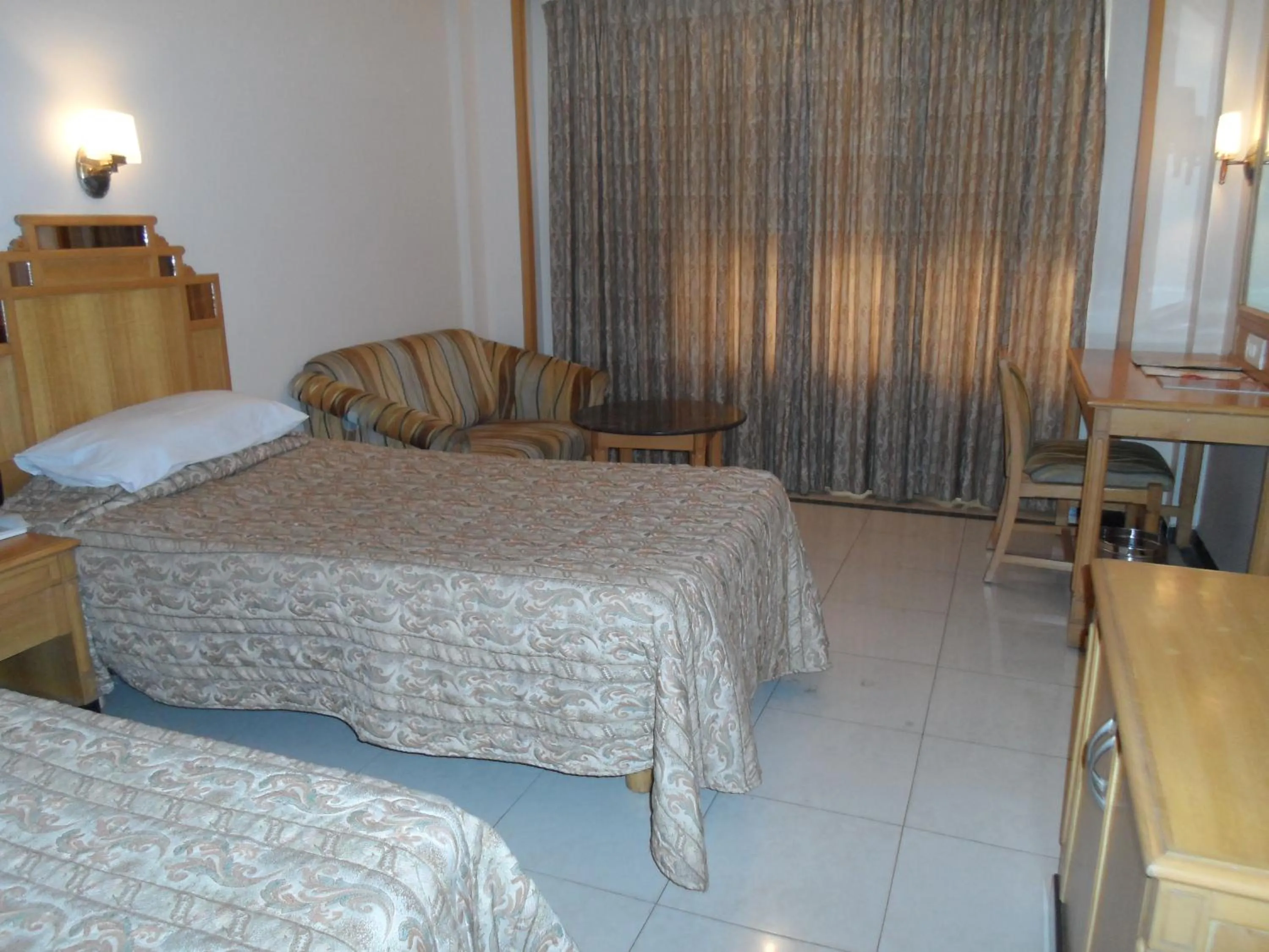 Bed in Hotel Kalyan Residency