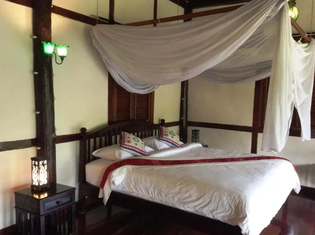 Photo of the whole room, Bed in Lao Spirit Resort Photo of the whole room, Bed in Lao Spirit Resort