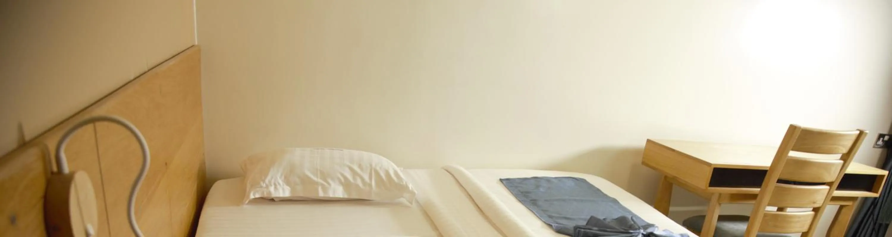 Bed in Victoria Mews Hotel