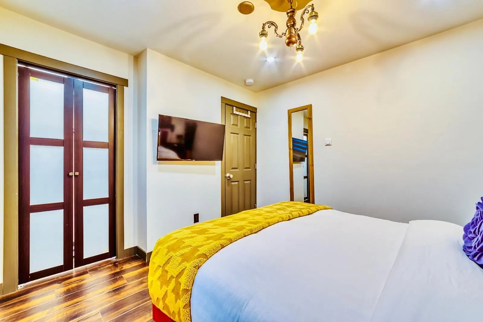 Bed in Neocolonial Nouveau Kensington Vacation Home