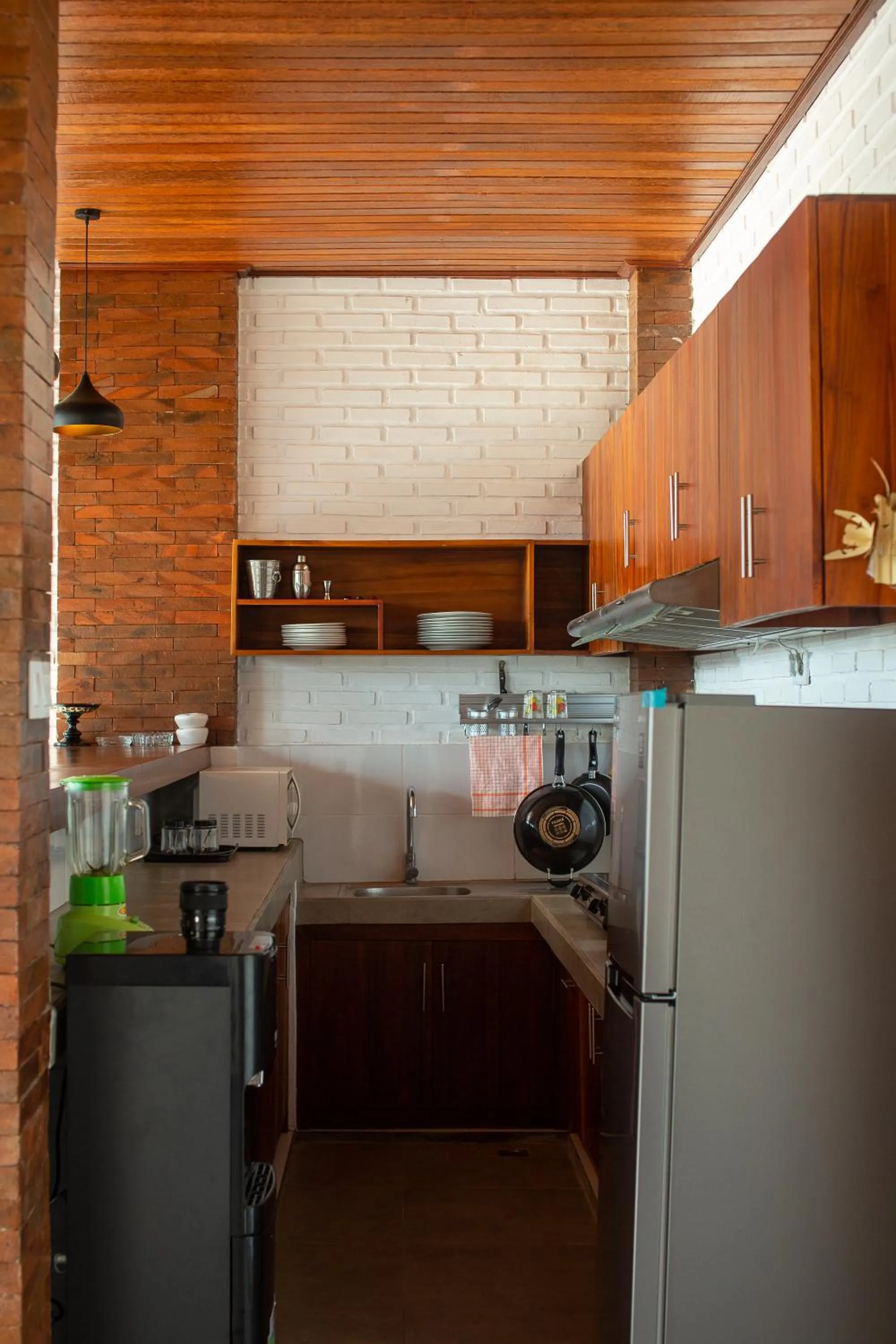 Communal kitchen in Frangipani House and Spa by ecommerceloka