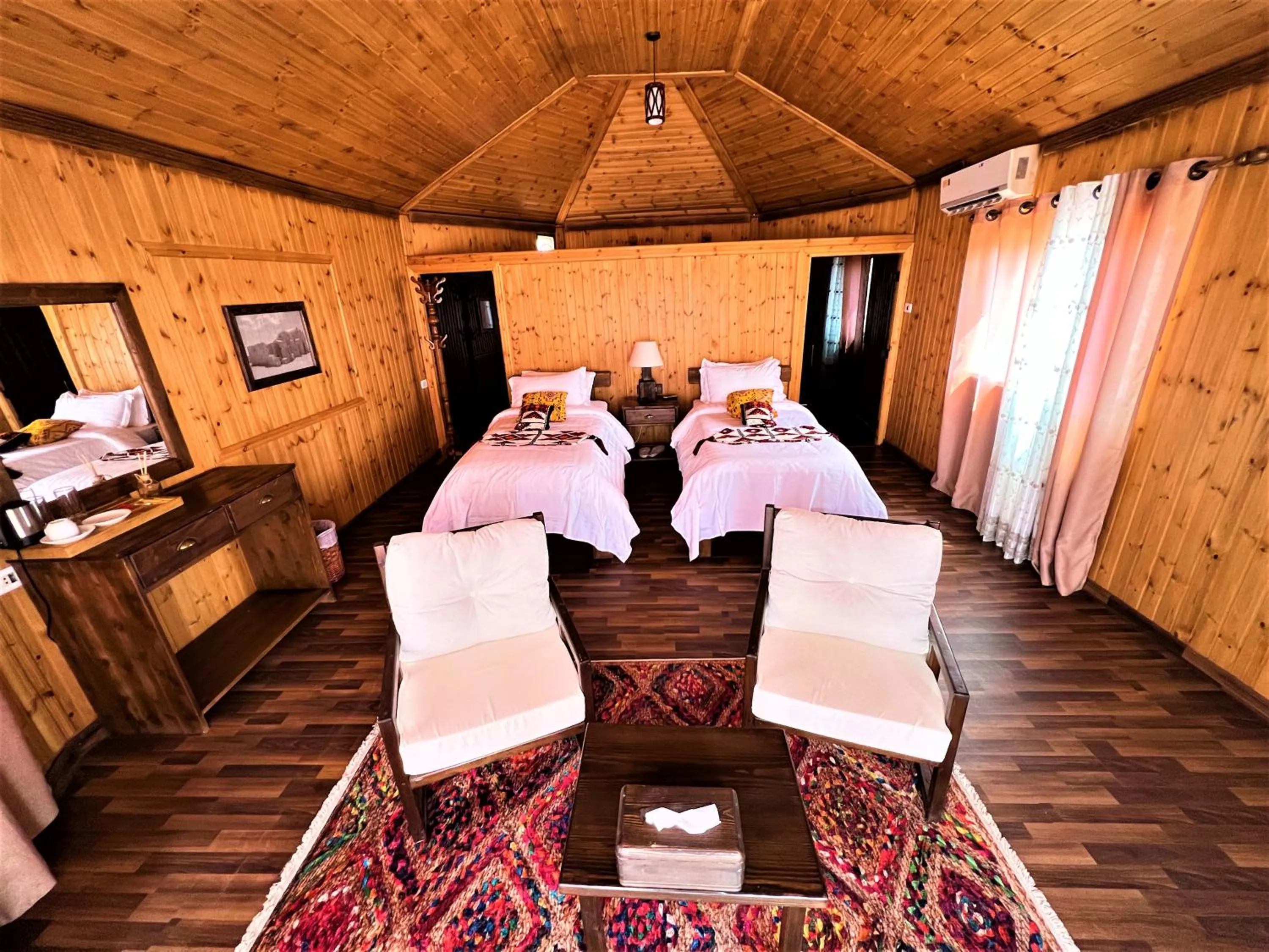 Living room, Bed in The Villas - Bedouin Boutique Resort