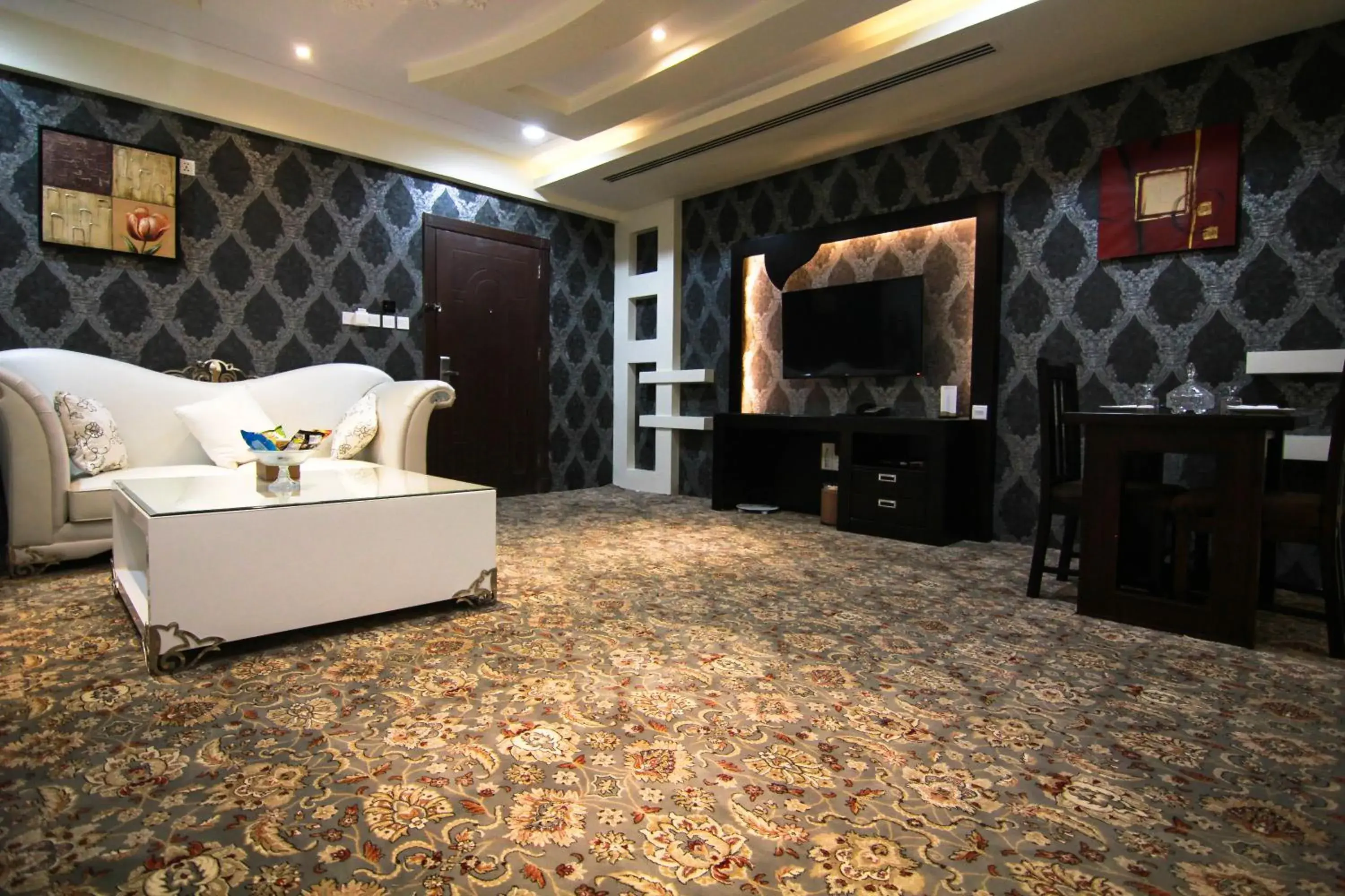 Lounge or bar in Rest Night Serviced Apartments- AlHamra Lounge or bar in Rest Night Serviced Apartments- AlHamra