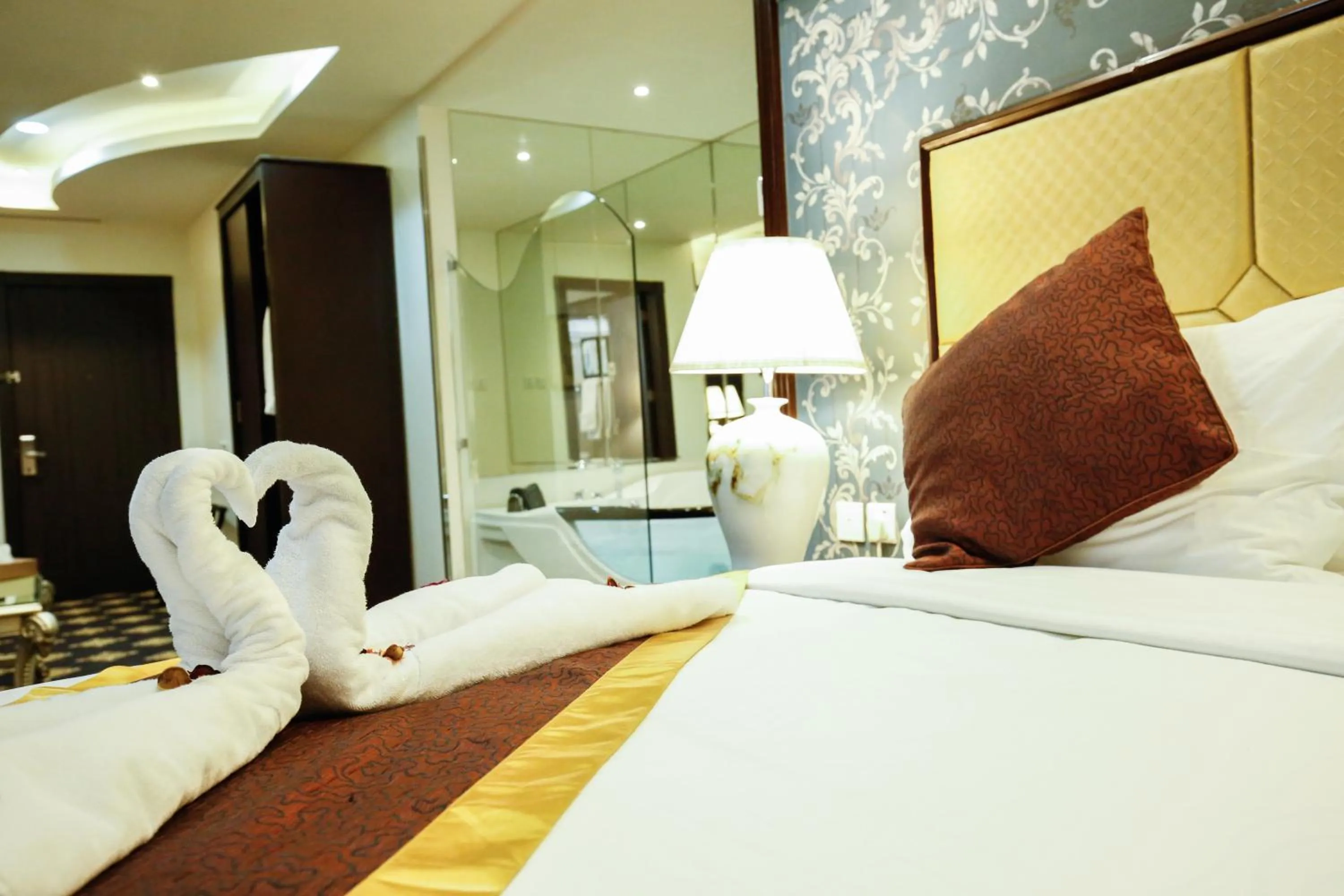 Decorative detail, Bed in Rest Night Serviced Apartments- AlHamra