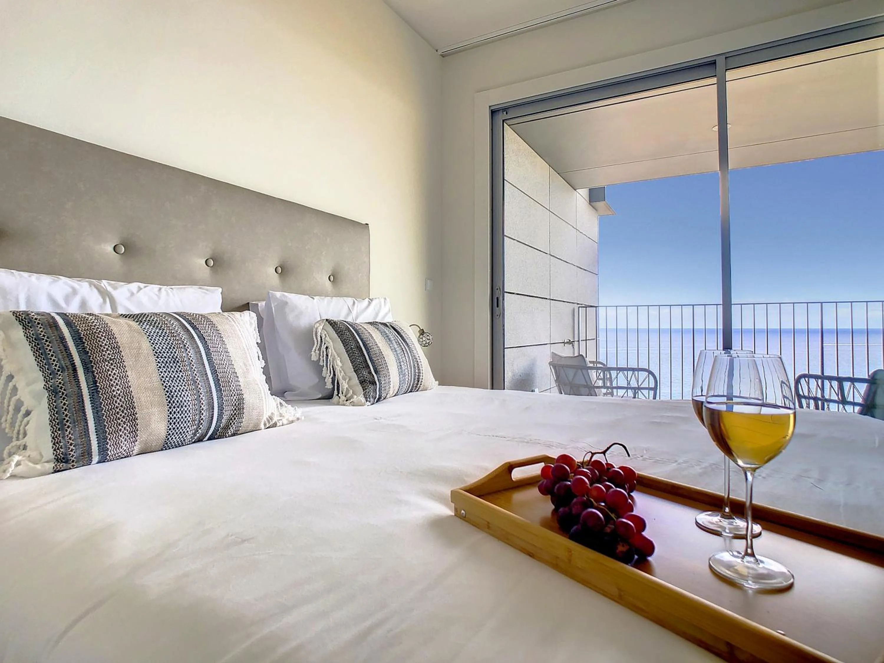 Bed in The Best Sea View Apartment by LovelyStay