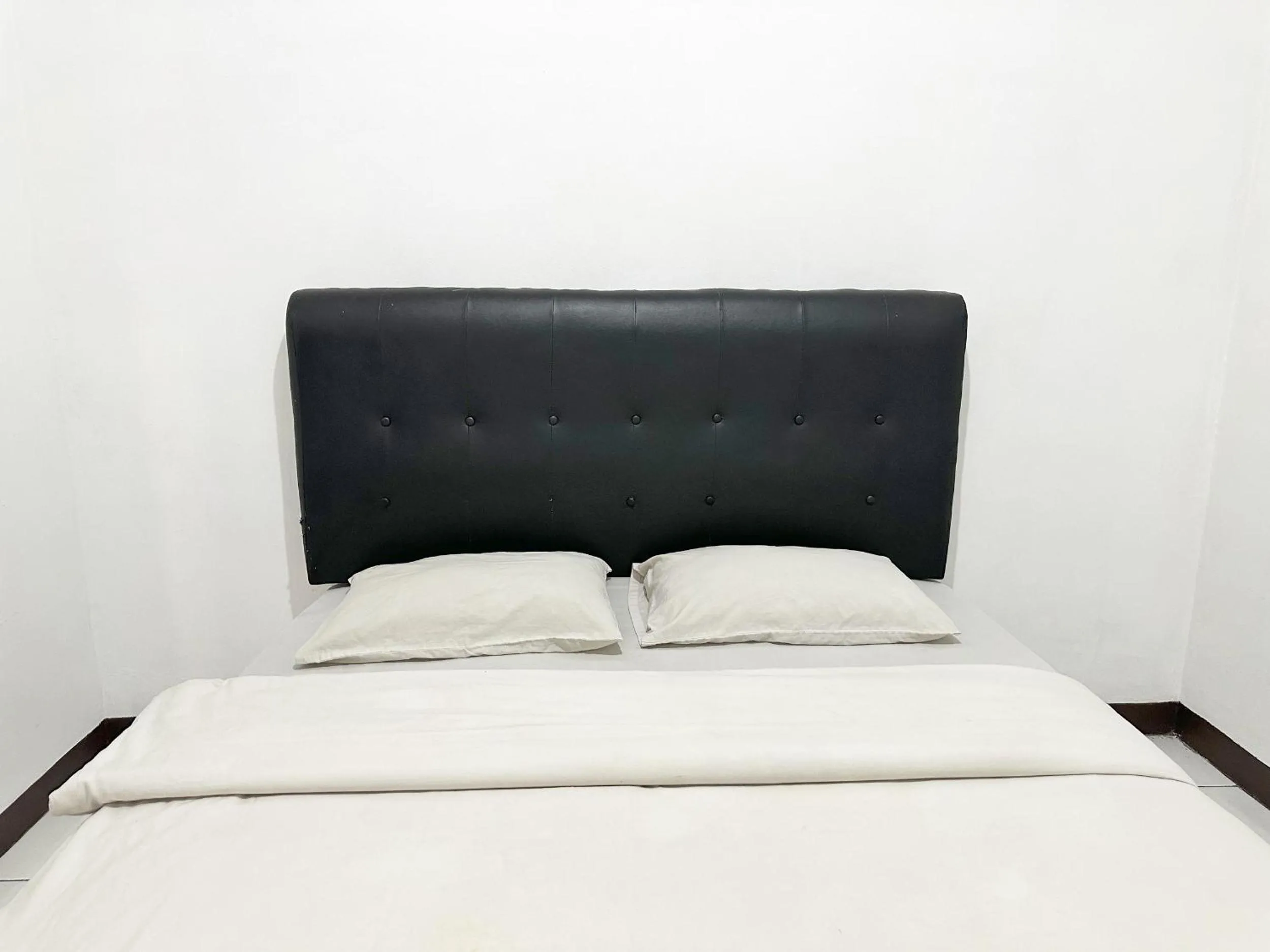 Bed in OYO 1608 Feby Maisonatte