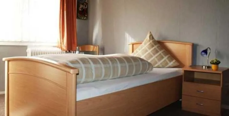 Photo of the whole room, Bed in Gasthaus Pension Schumbert