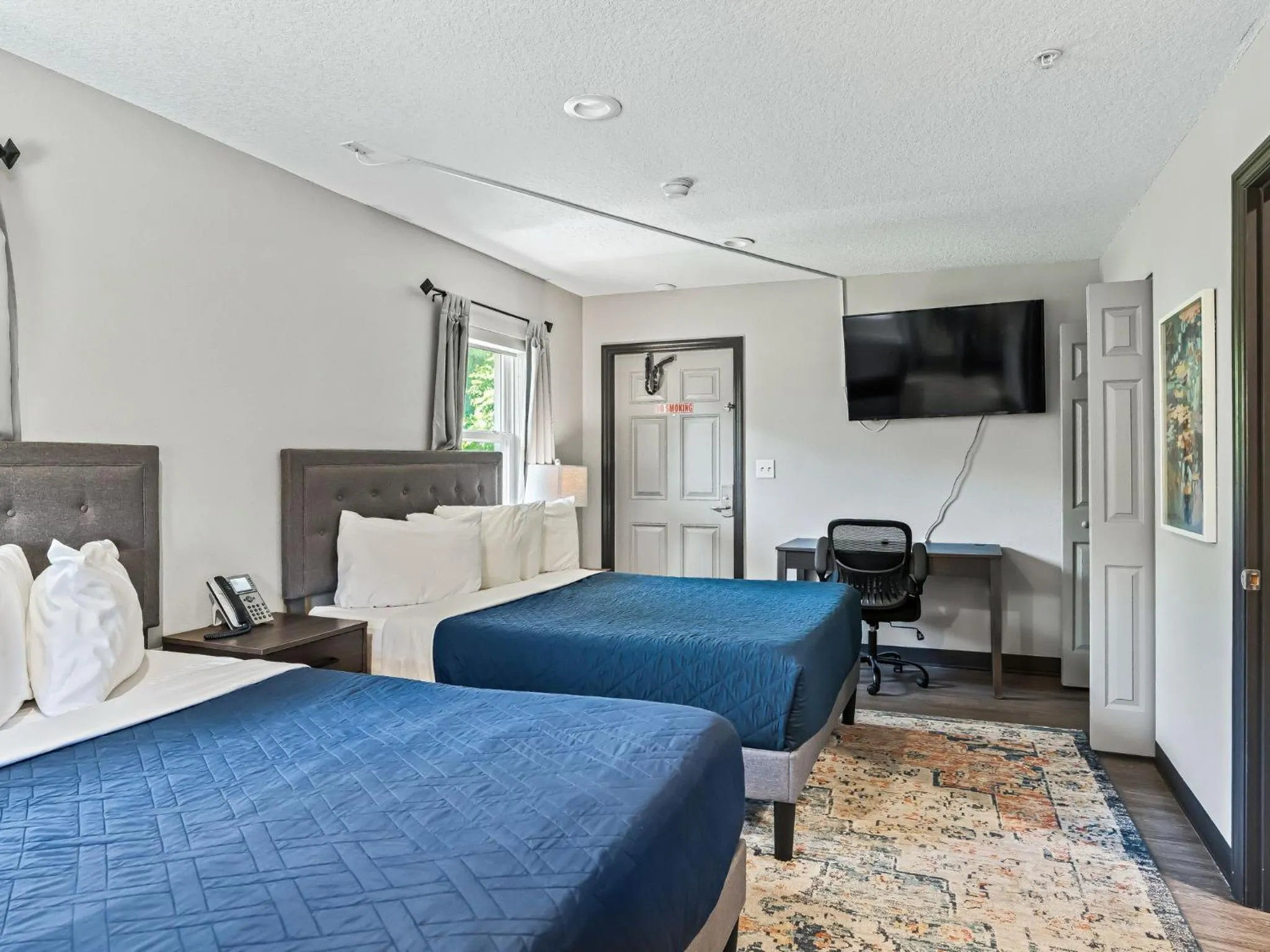 Bedroom, Bed in Baymont by Wyndham Ocala Suites