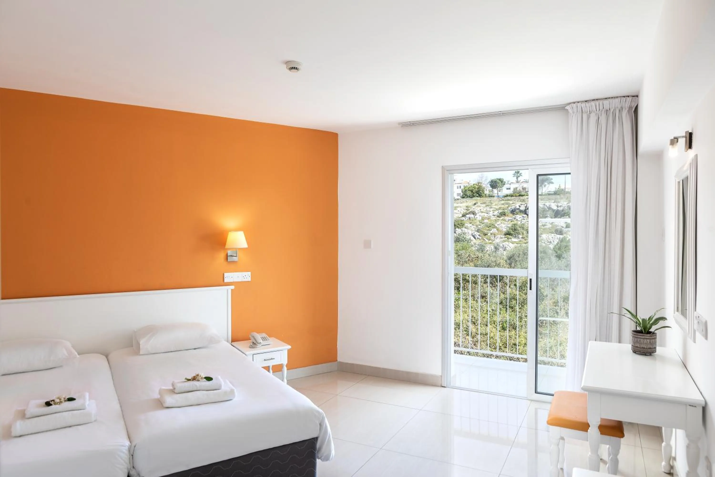 Bed in Mia Hotel Apartment