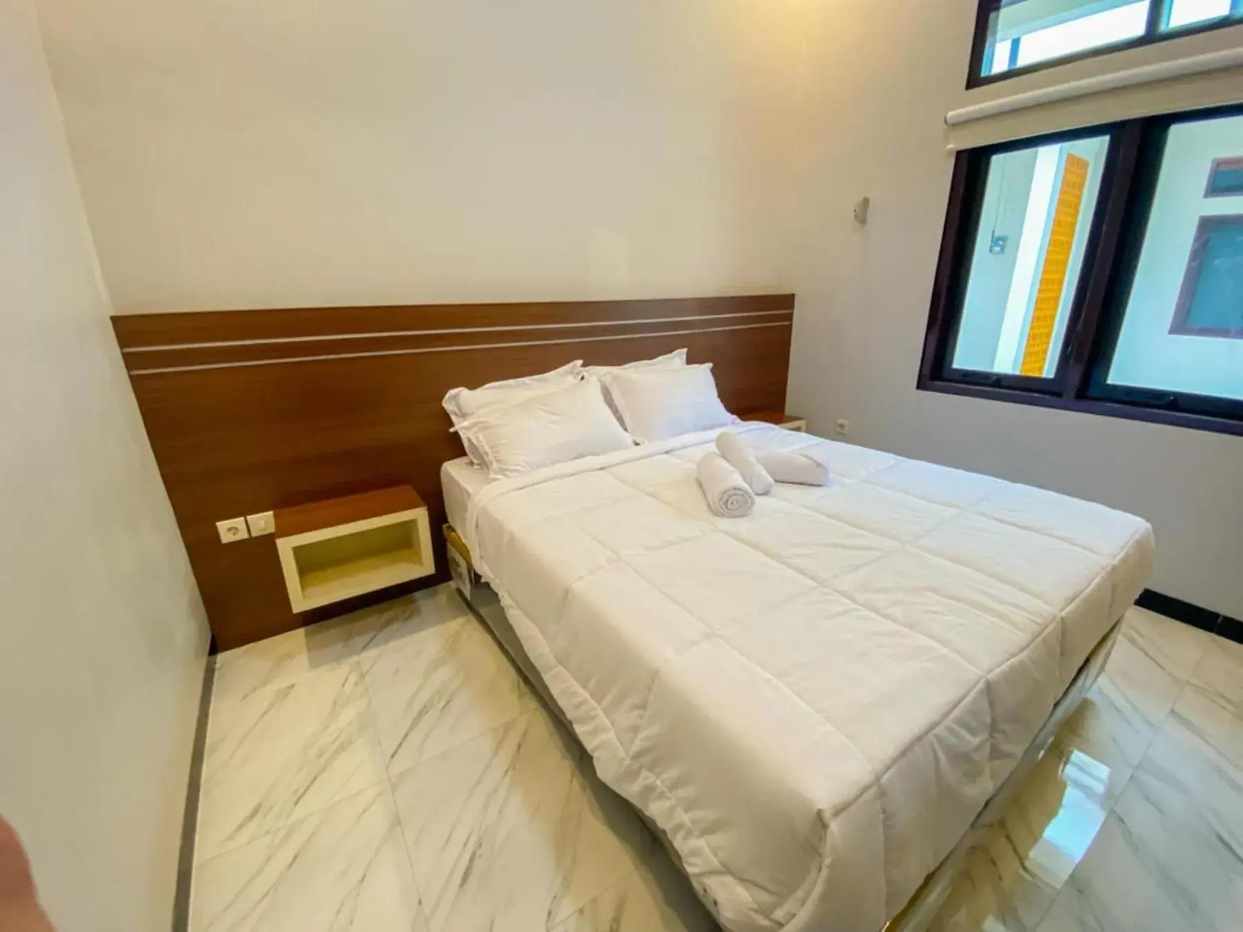 Bedroom, Bed in RedDoorz Plus at Orange Diponogoro Palangkaraya Bedroom, Bed in RedDoorz Plus at Orange Diponogoro Palangkaraya