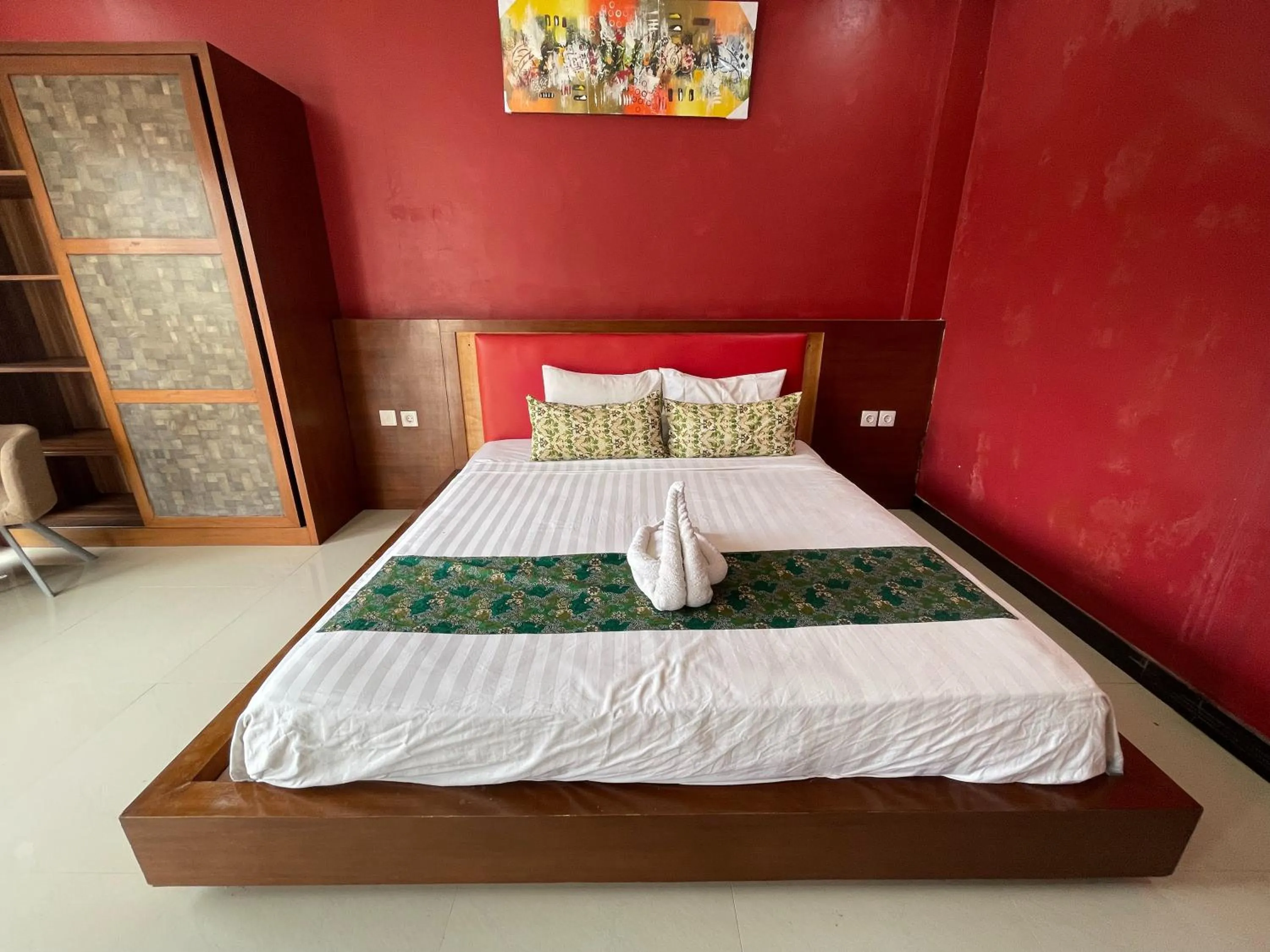 Bed in Melati Resort & Hotel Kuta Lombok