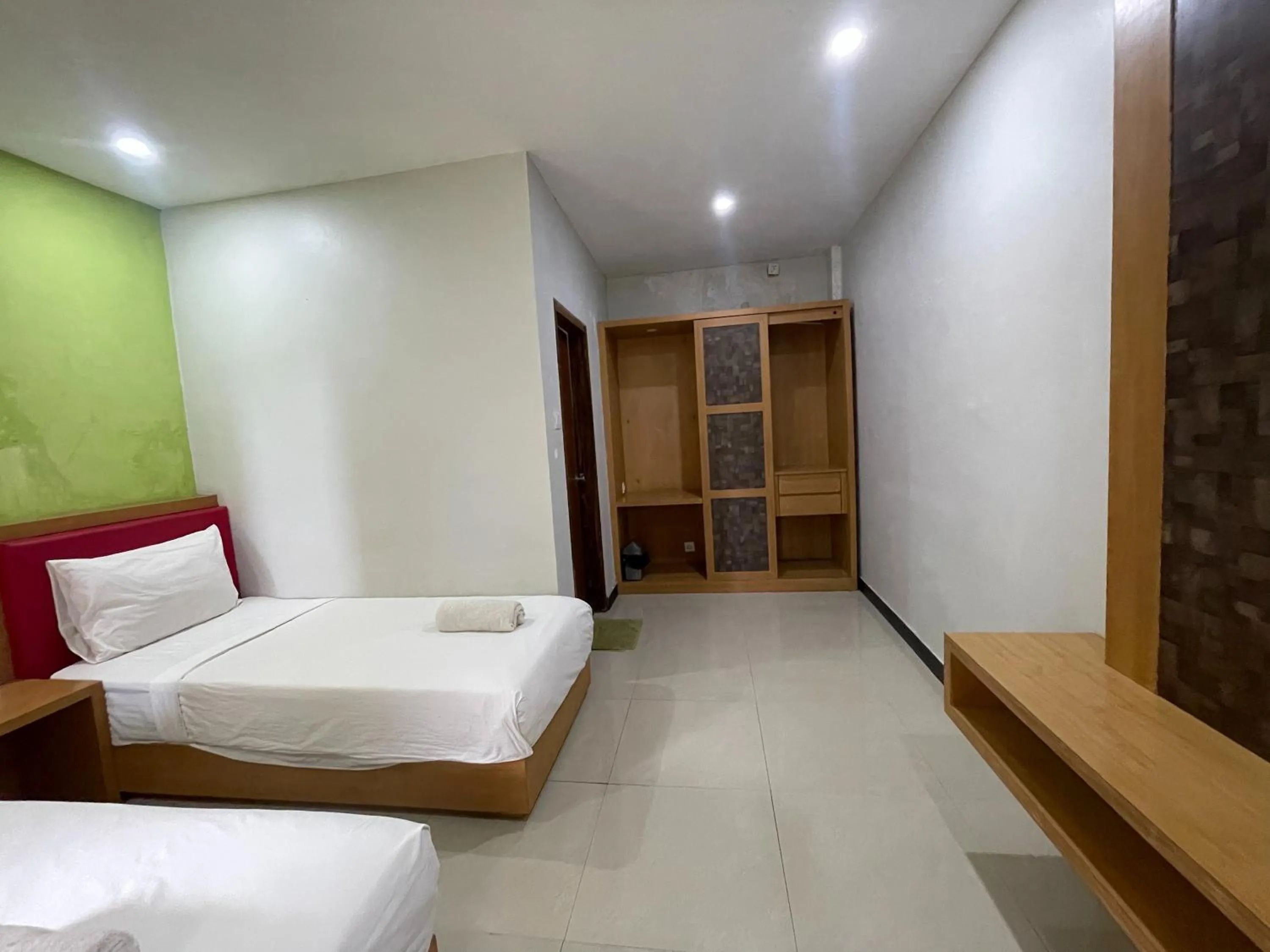 Bed in Melati Resort & Hotel Kuta Lombok