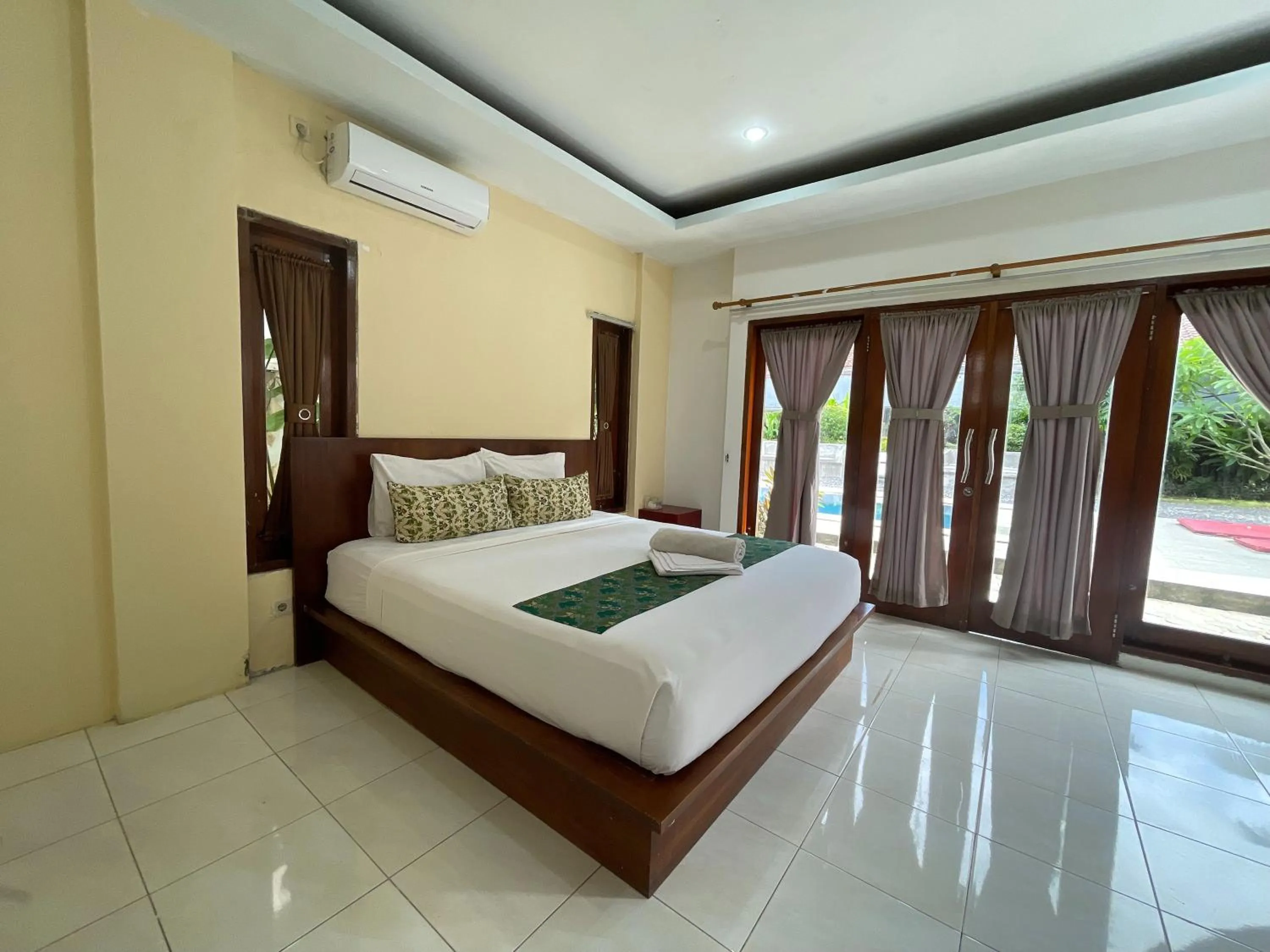 Bed in Melati Resort & Hotel Kuta Lombok