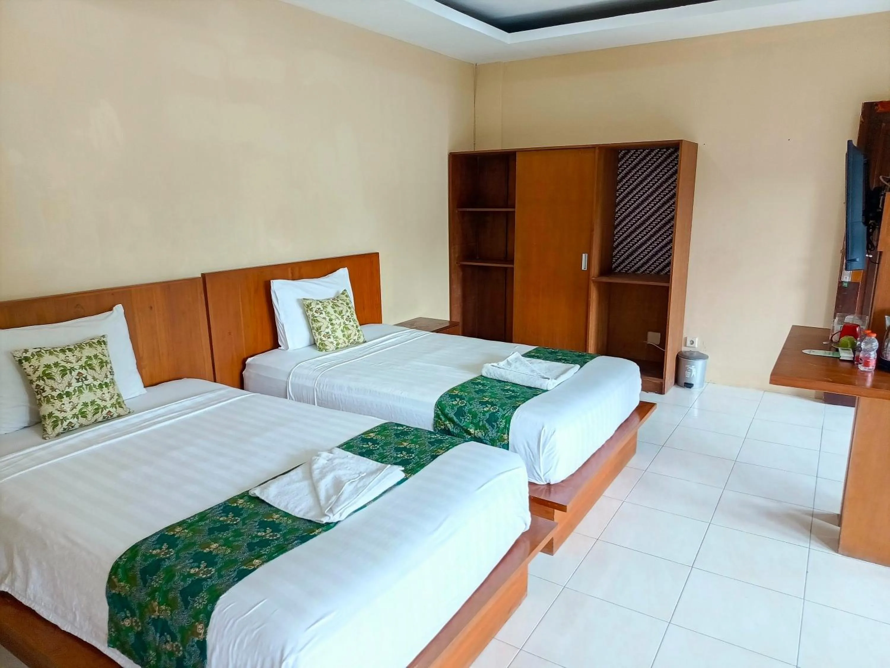 Bed in Melati Resort & Hotel Kuta Lombok