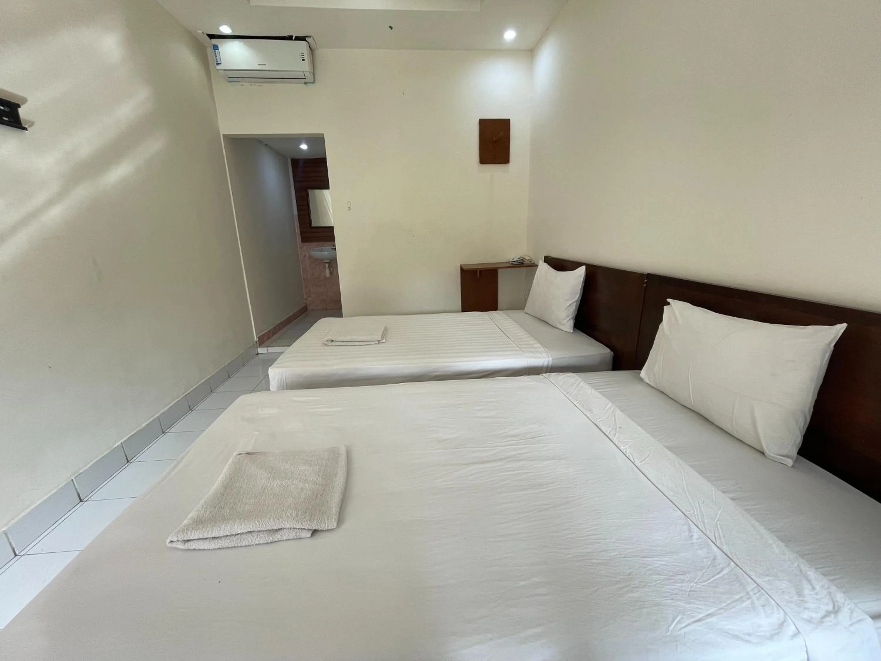 Bed in Melati Resort & Hotel Kuta Lombok