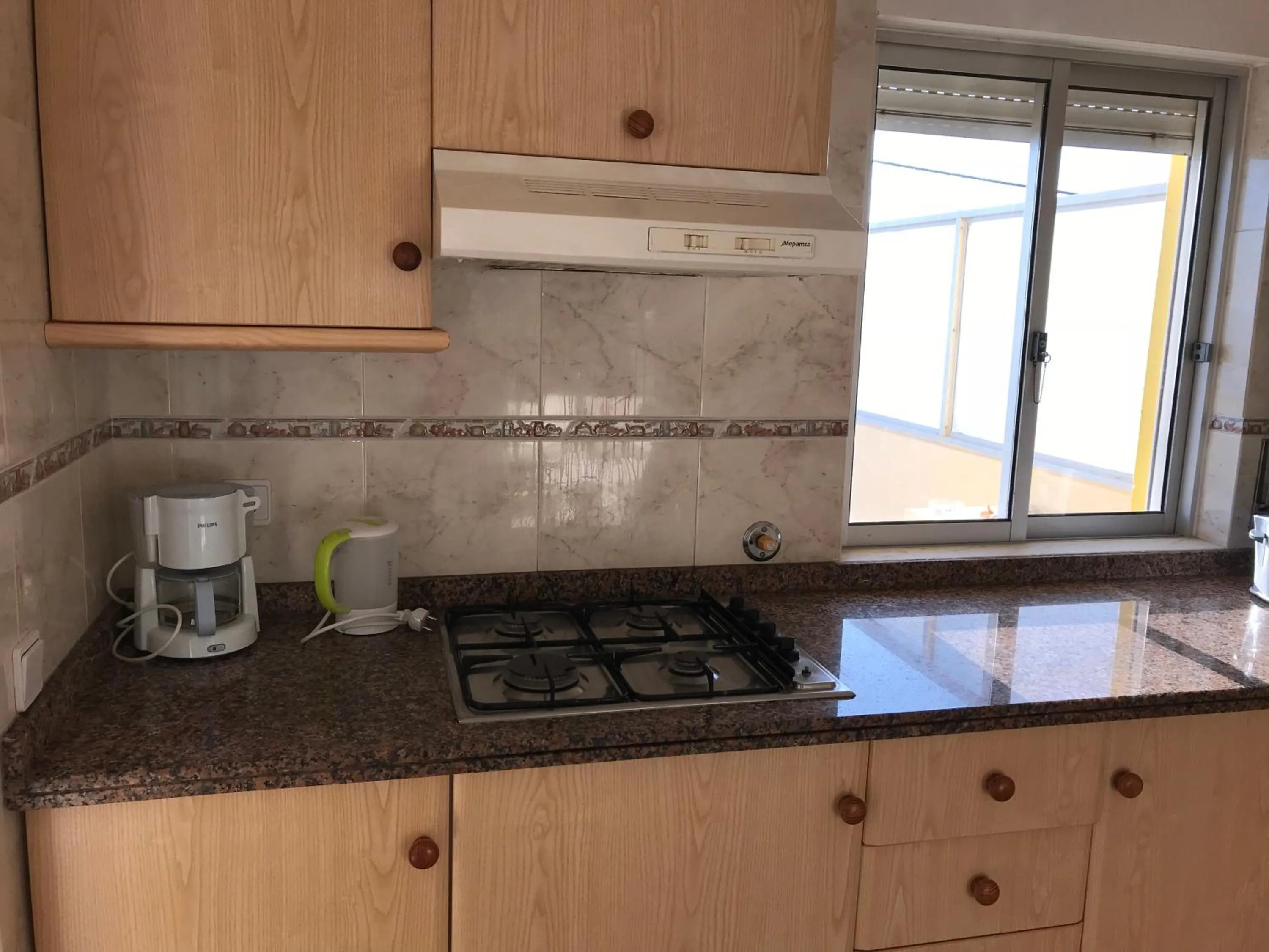 Kitchen or kitchenette in Apartamentos Barracuda