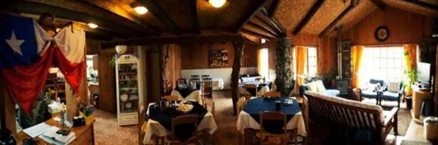 Communal lounge/ TV room in Hosteria Rayen