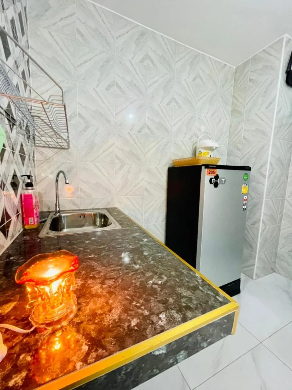 Kitchen or kitchenette in โรงแรมเรือนคุณเล็ก กานต์สินี