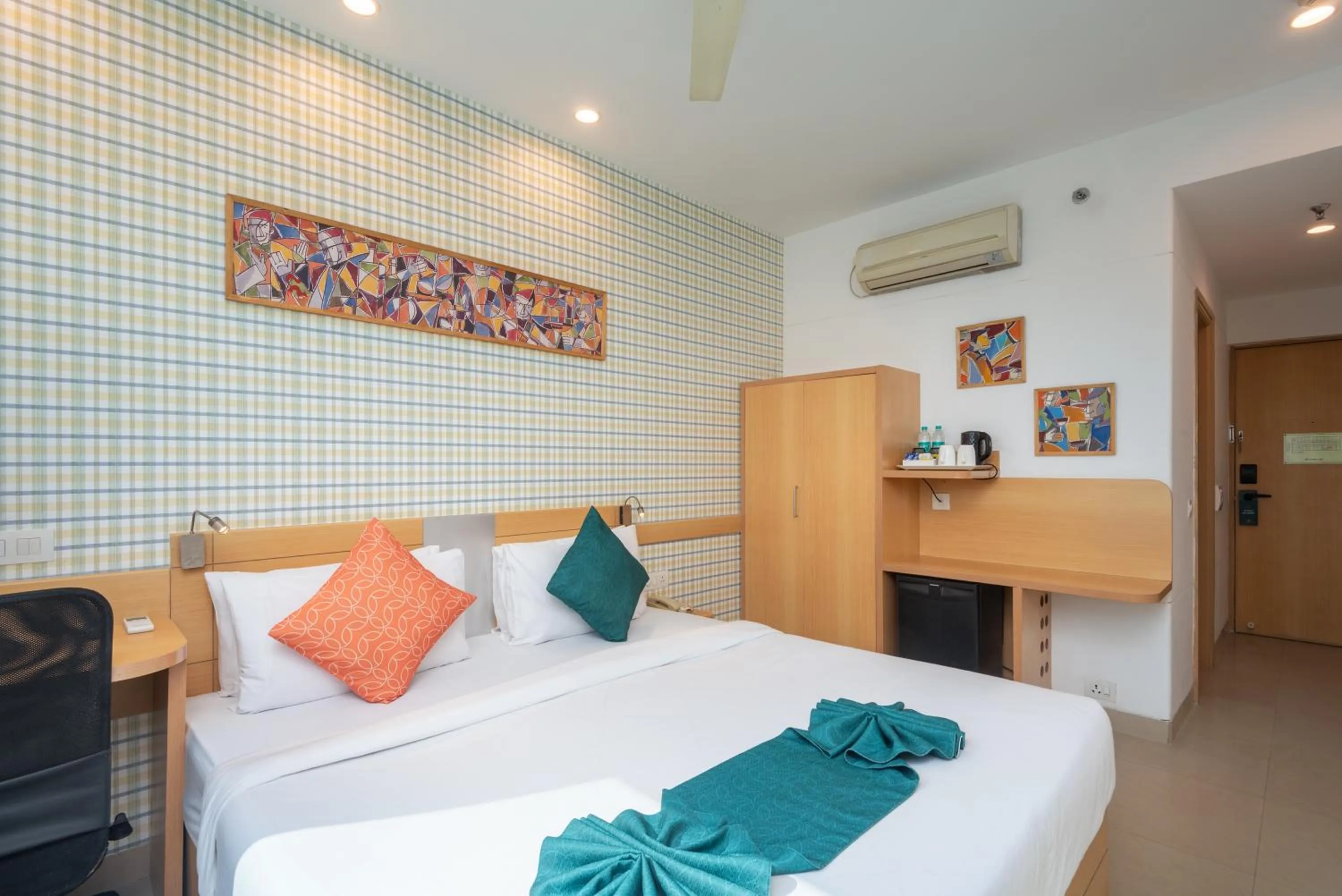 Bed in Mango Grove Hotel