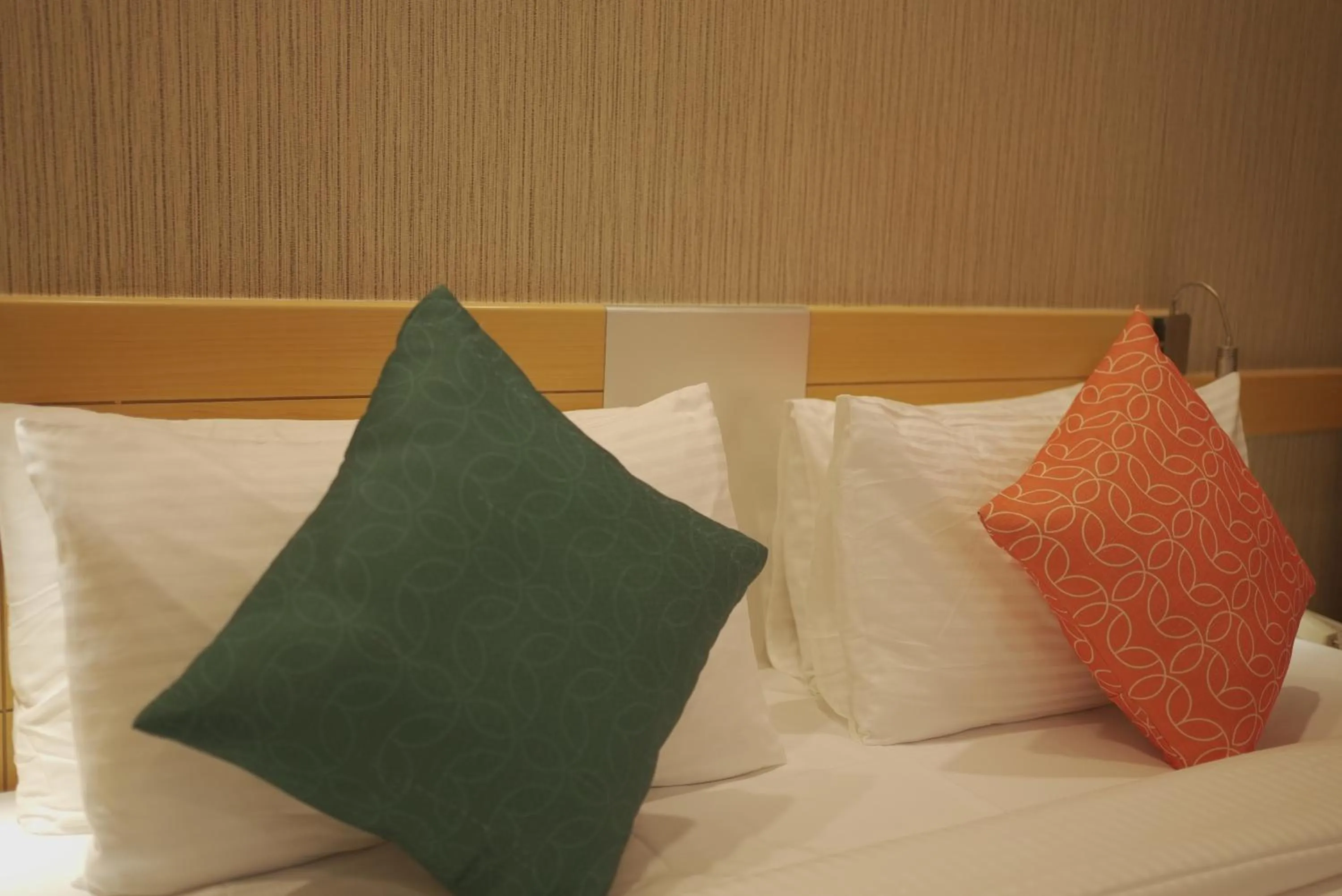 Bed in Mango Grove Hotel