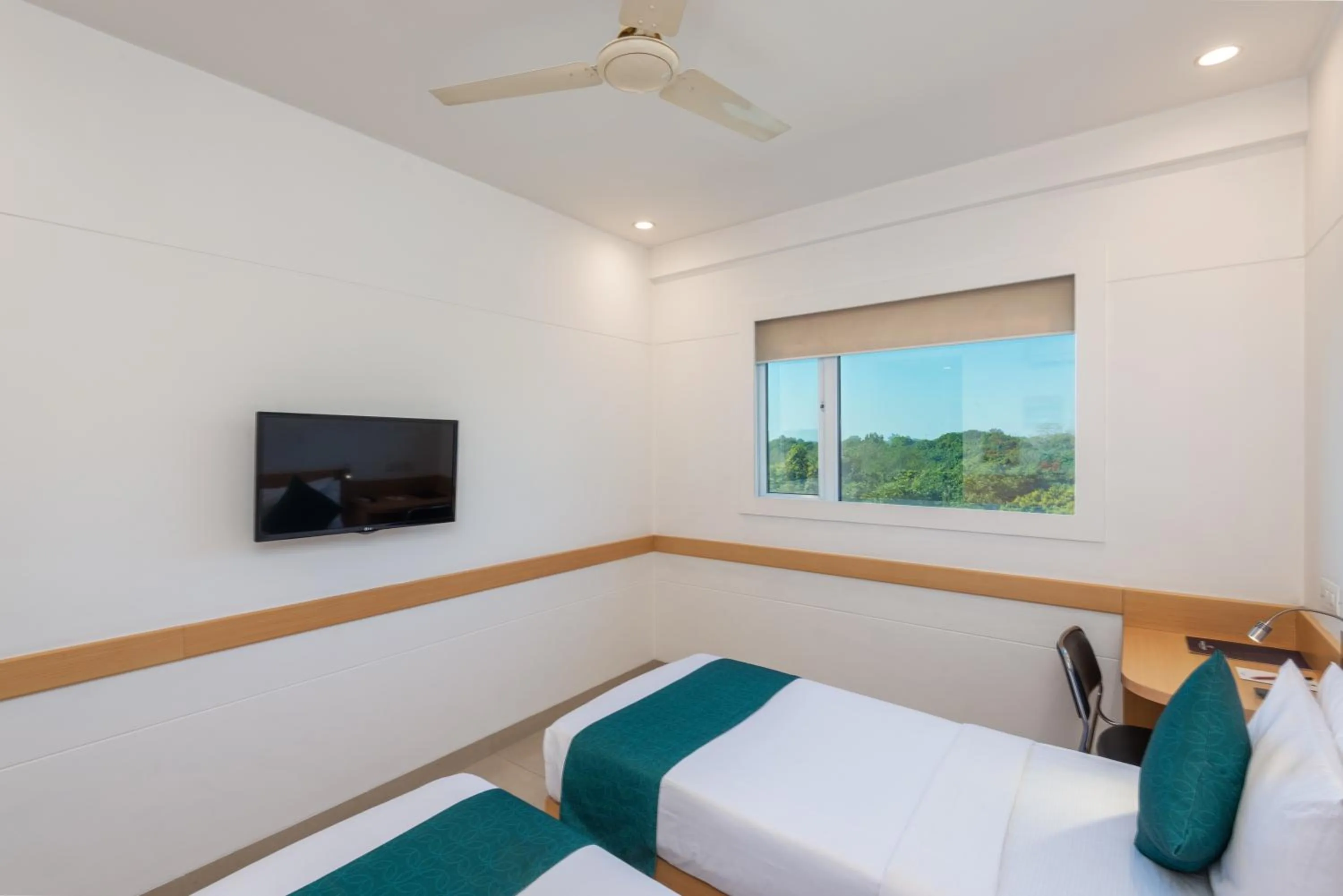 Bed in Mango Grove Hotel