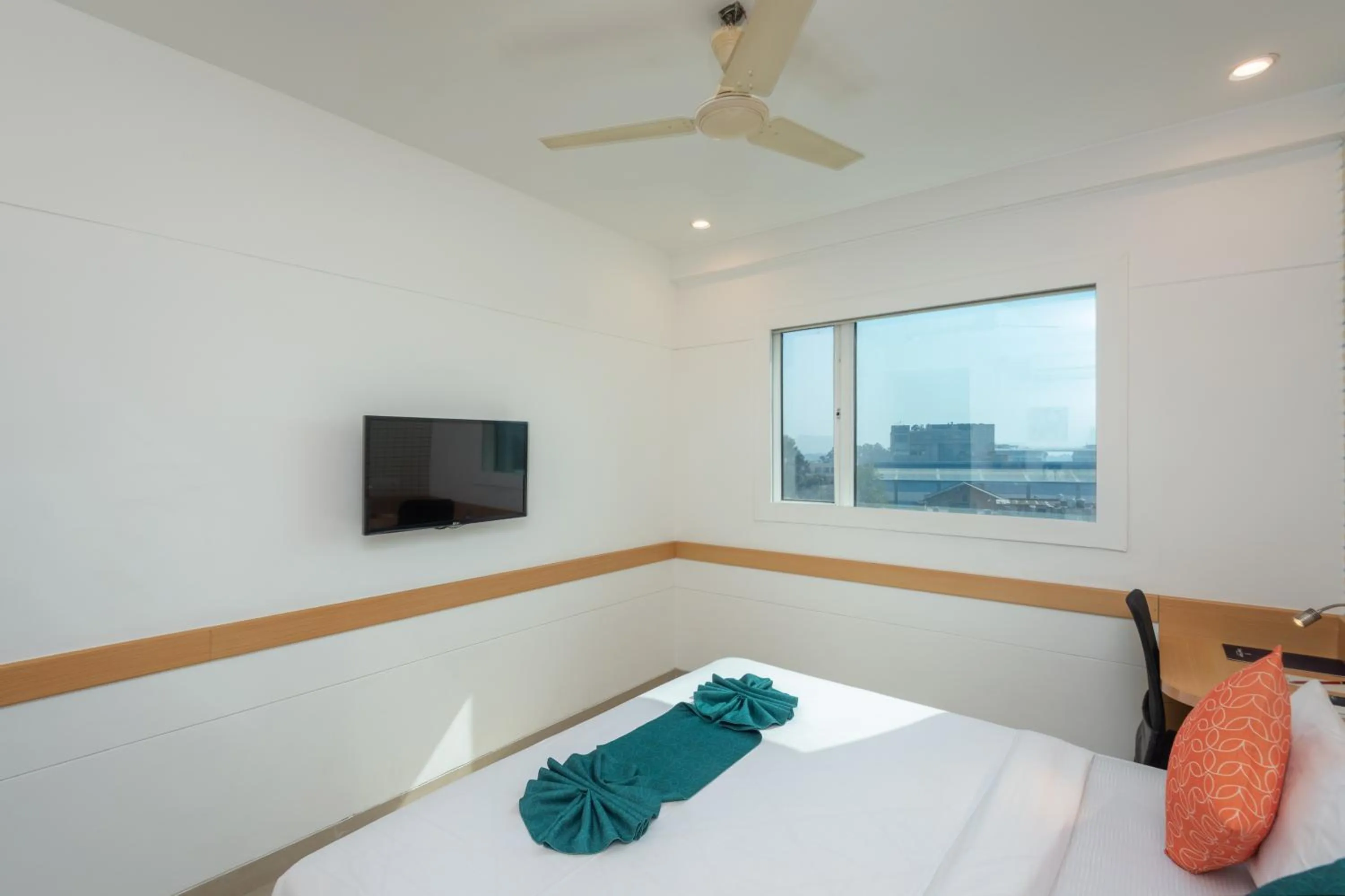 Bed in Mango Grove Hotel