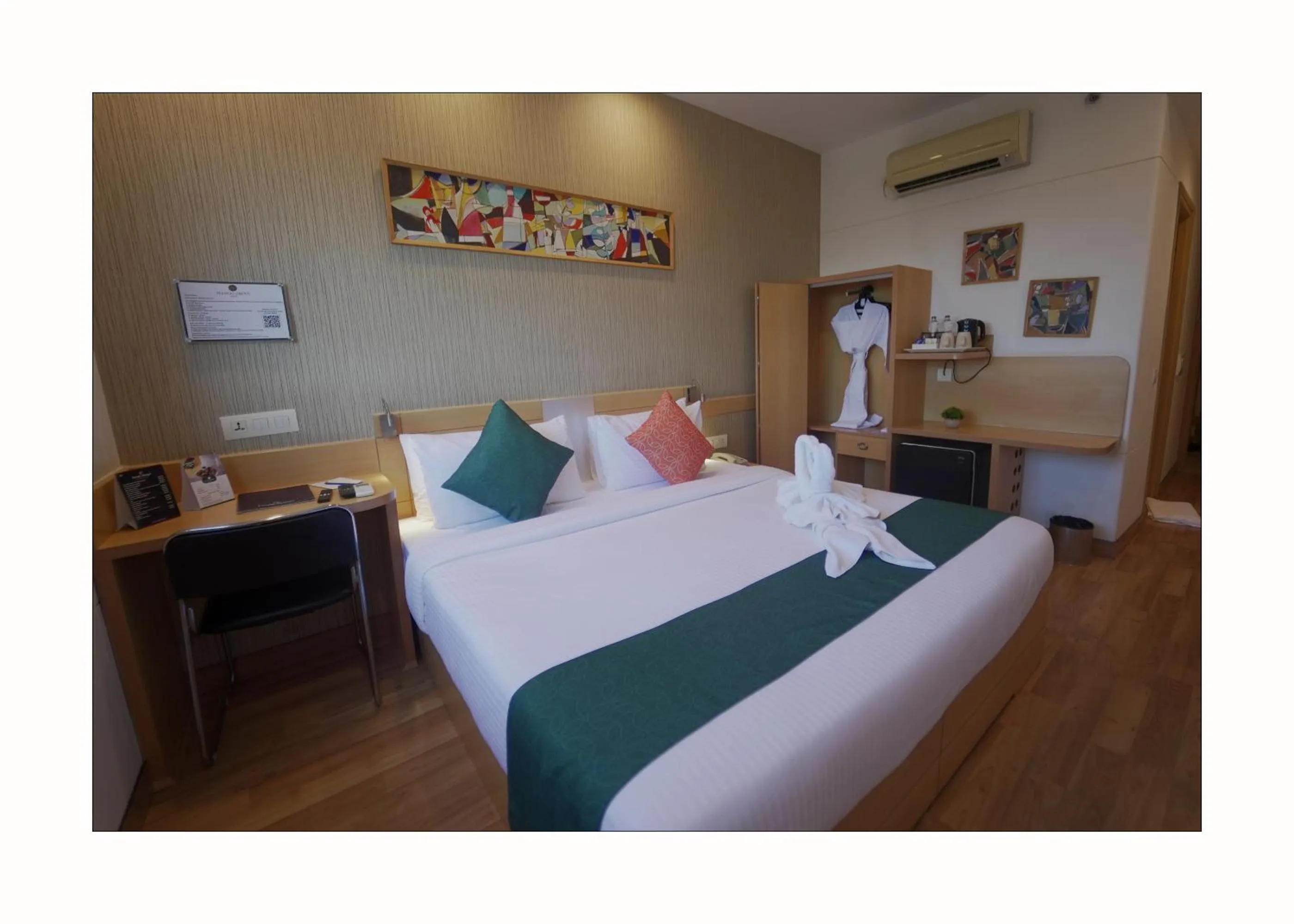 Bed in Mango Grove Hotel