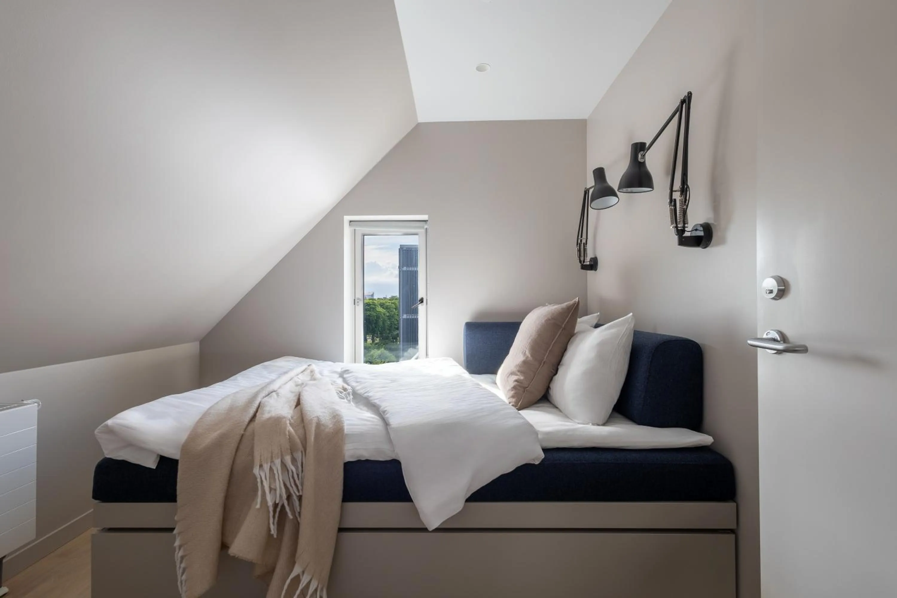 Bed in Unity Malmö - A Studio Hotel