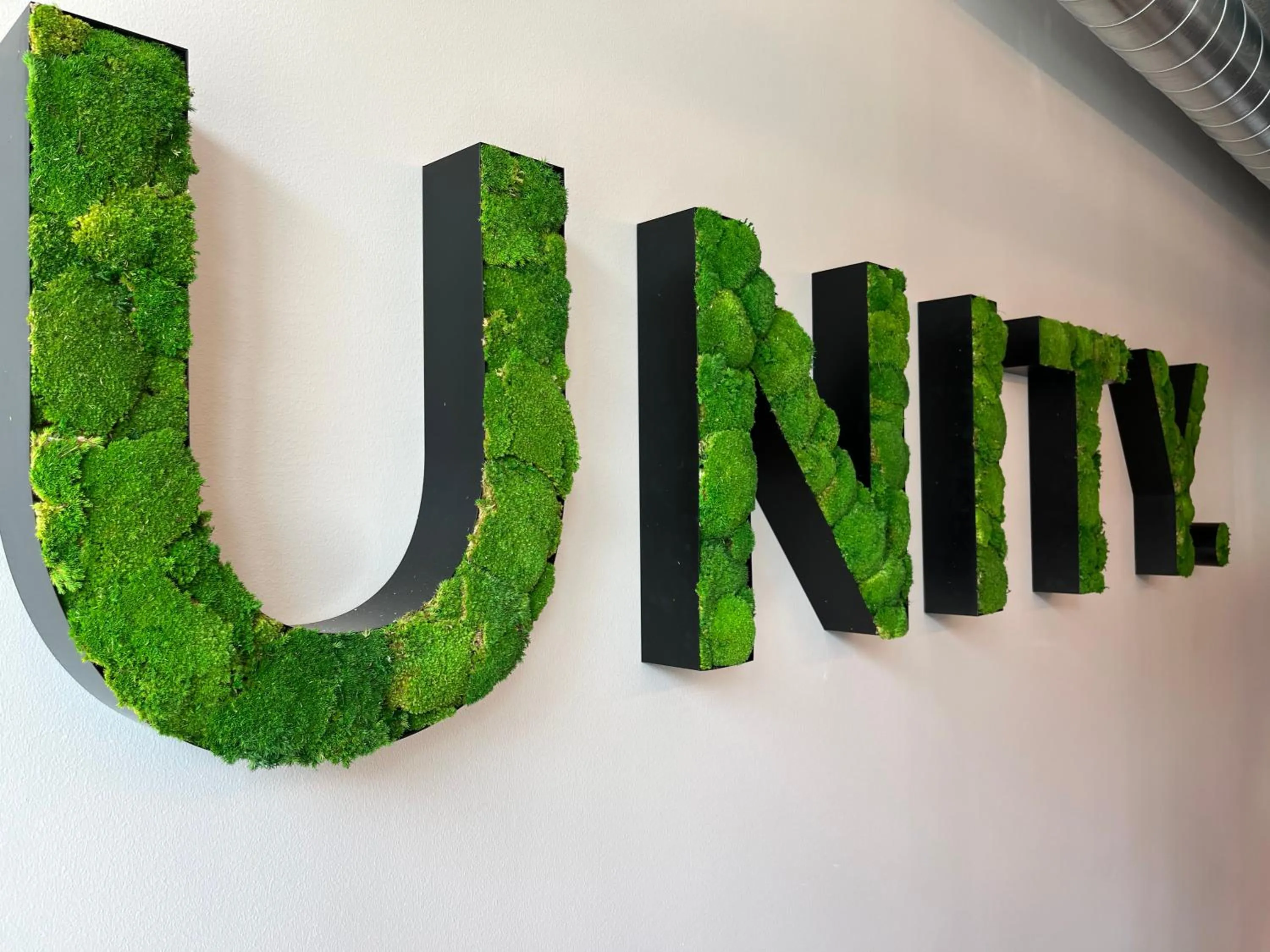 Property logo or sign in Unity Malmö - A Studio Hotel