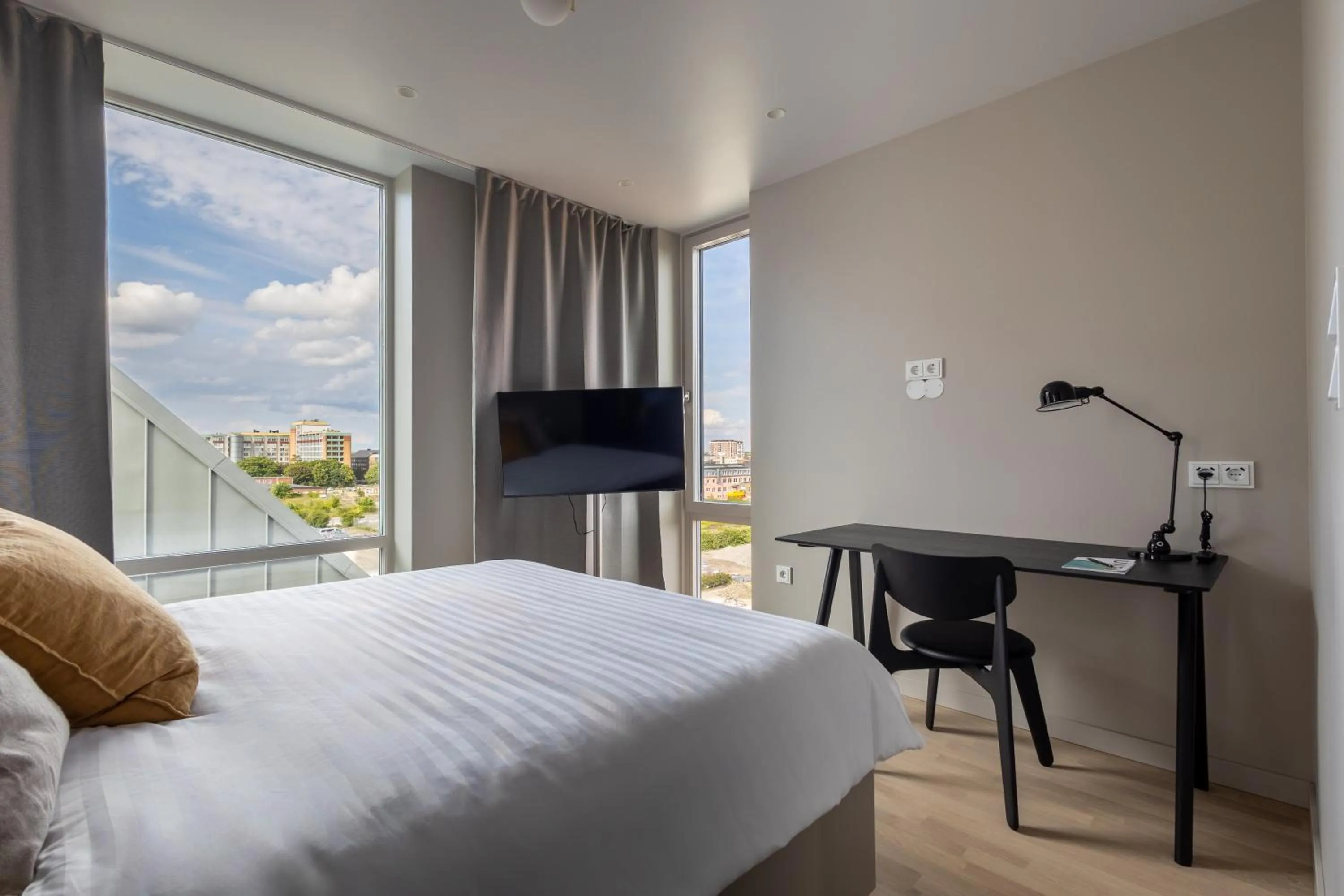 Bed in Unity Malmö - A Studio Hotel