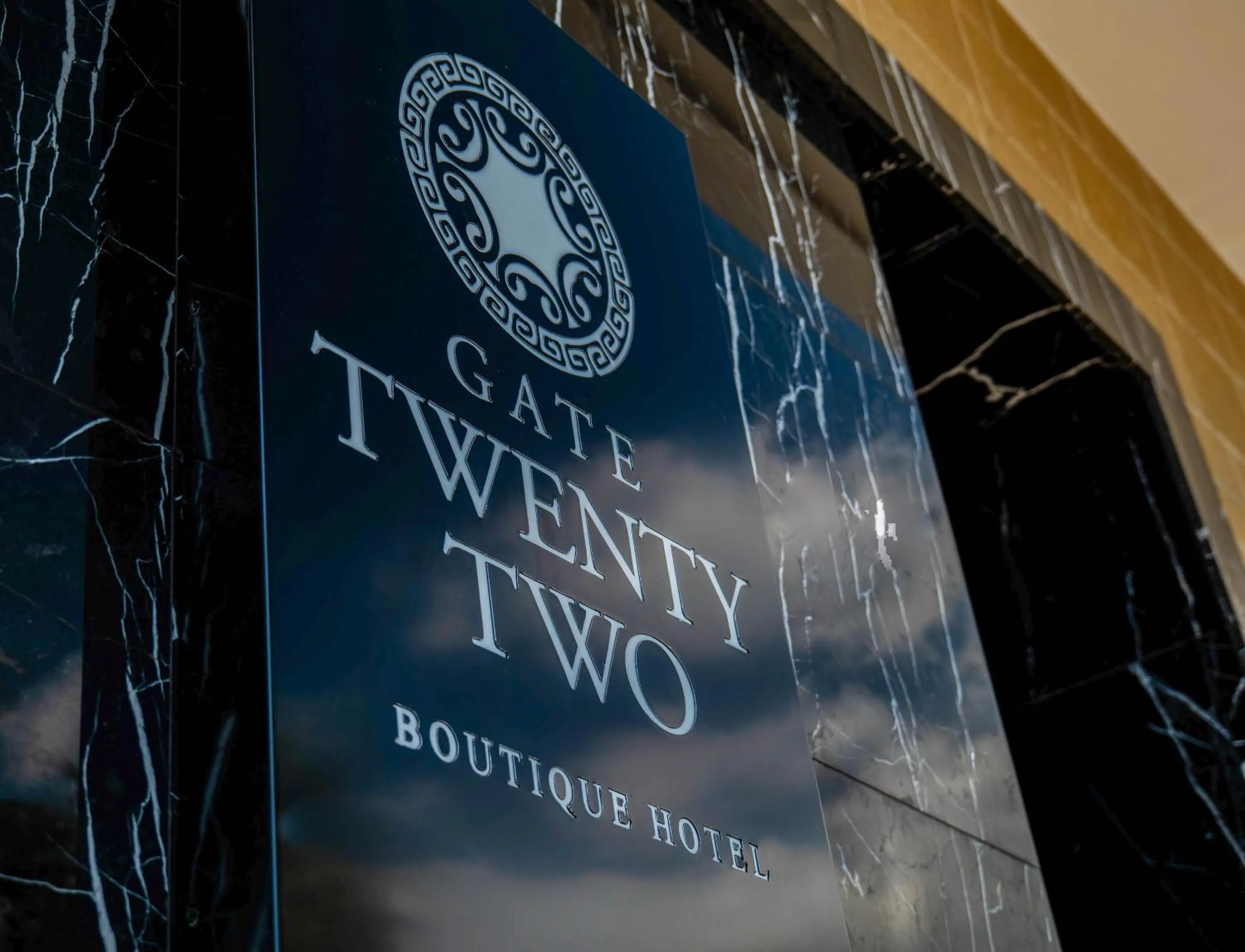 Property logo or sign in Gate Twenty Two Boutique Hotel