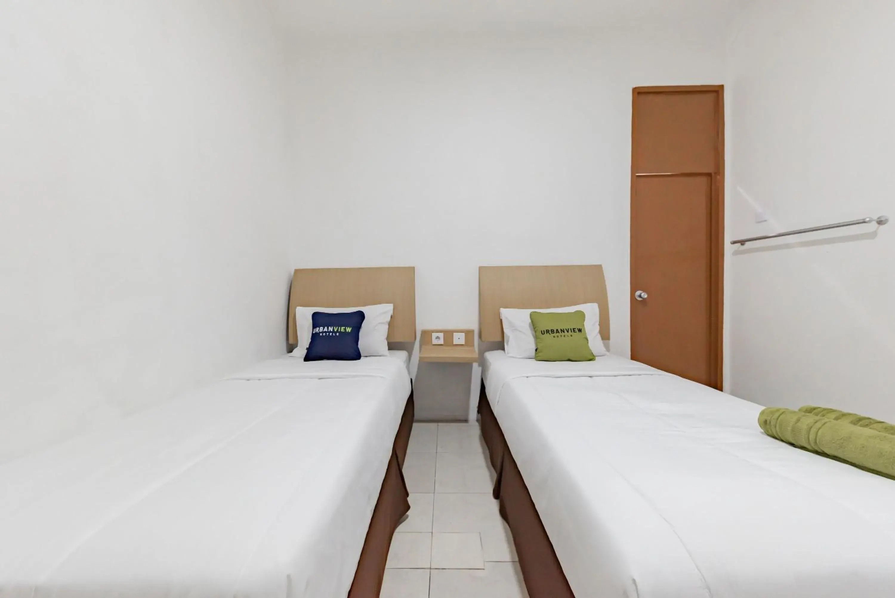 Bedroom, Bed in Urbanview Hotel Cozy Samarinda by RedDoorz Bedroom, Bed in Urbanview Hotel Cozy Samarinda by RedDoorz