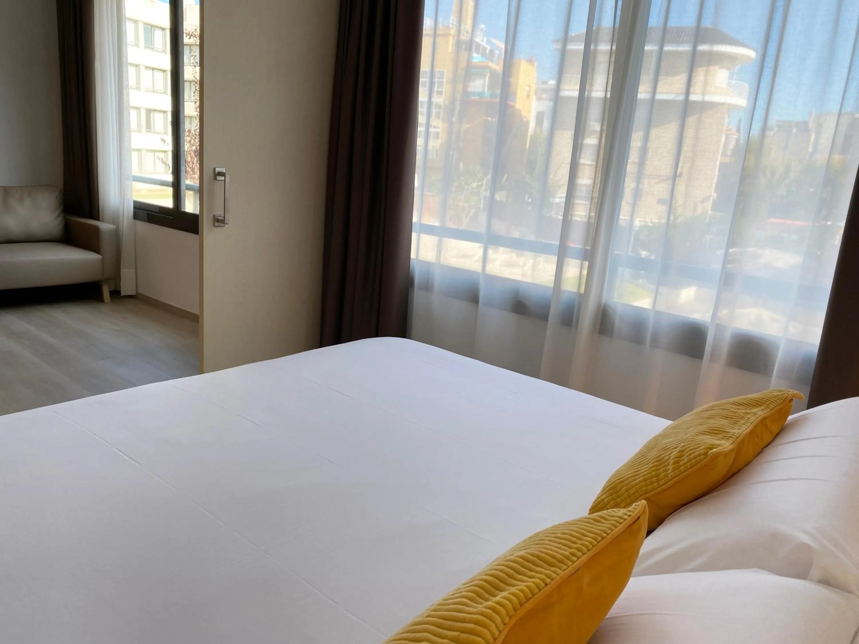 Bed in Atenea Park Suites & Apartments